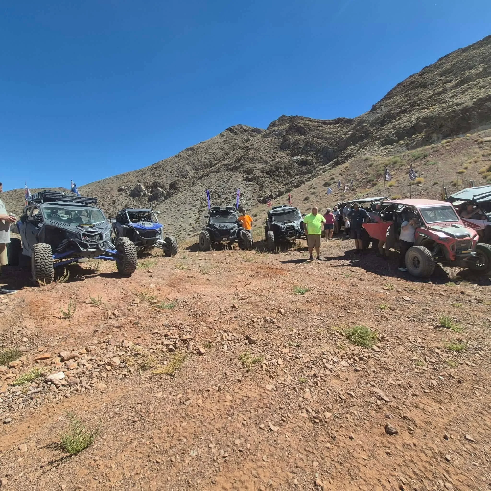 Off-road UTVs parked in a rocky canyon trail overlook during the 2026 Dyer - Fish Lake Poker Run