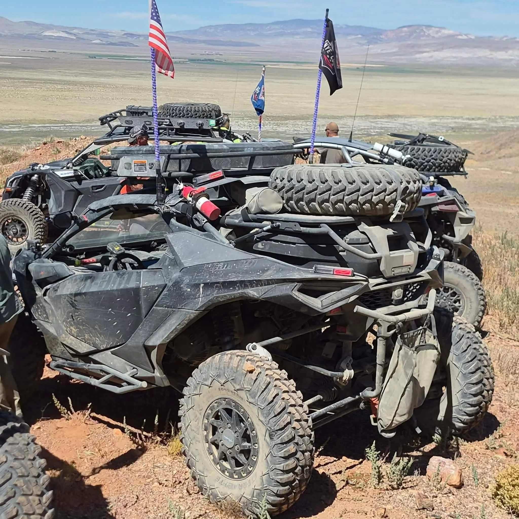 Heavily modified off-road UTV with flags parked in the desert during the 2026 Dyer - Fish Lake Poker Run