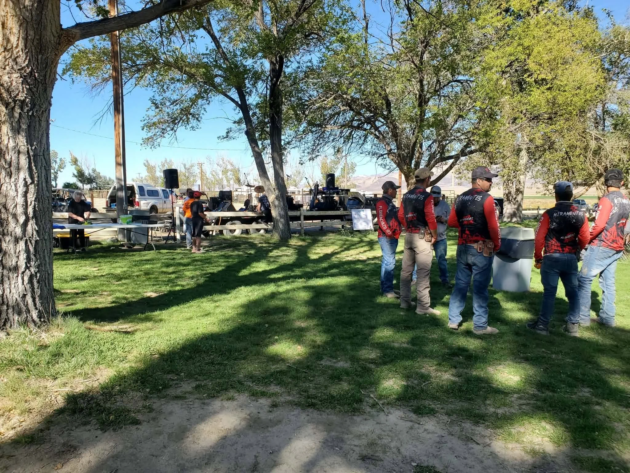 Riders gathered in the shade at the campground during the 2026 Dyer - Fish Lake Poker Run