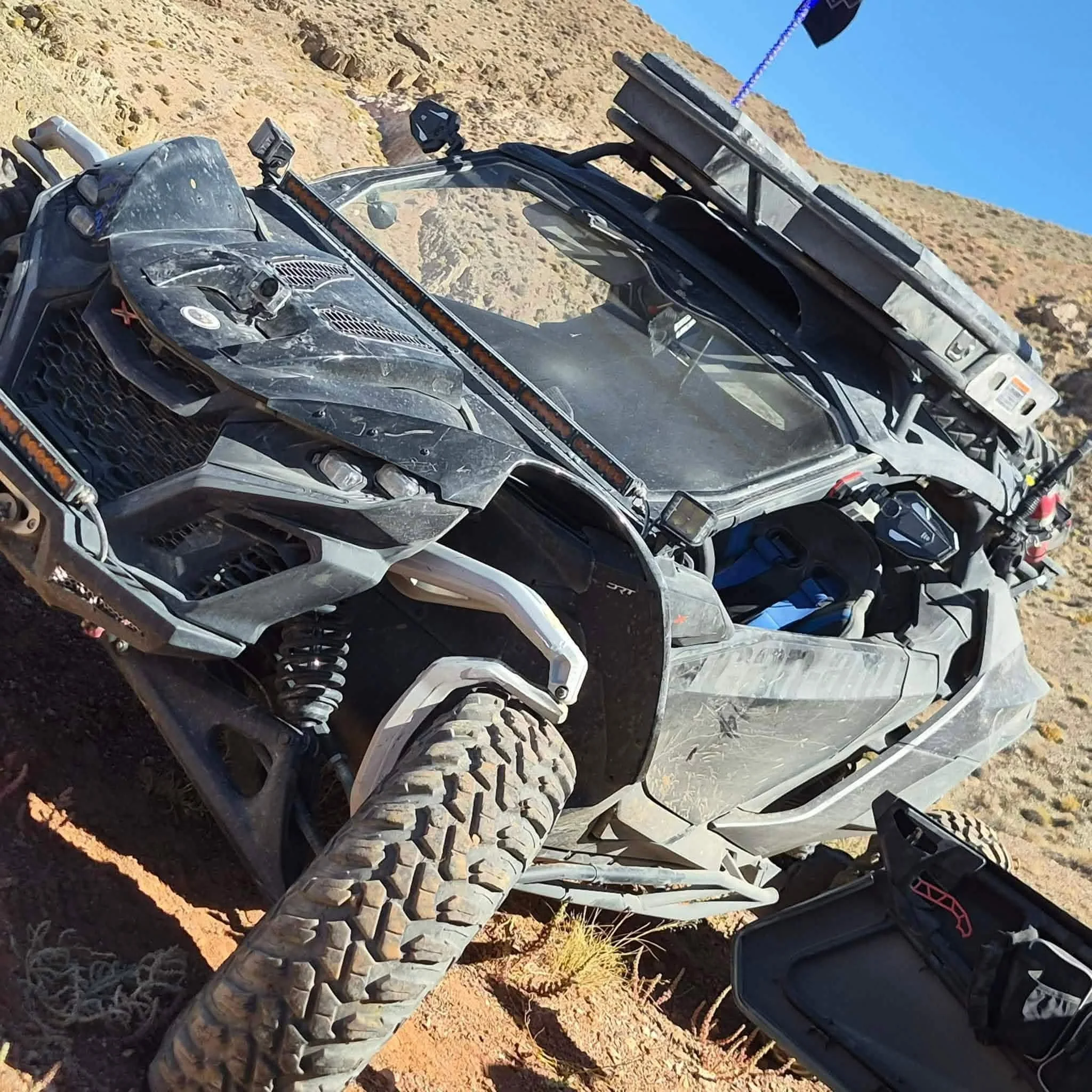 Off-road UTV climbing a rocky hillside trail during the 2026 Dyer - Fish Lake Poker Run