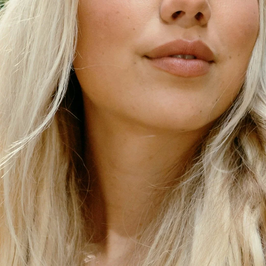 White blonde woman close up on lower face and skin texture
