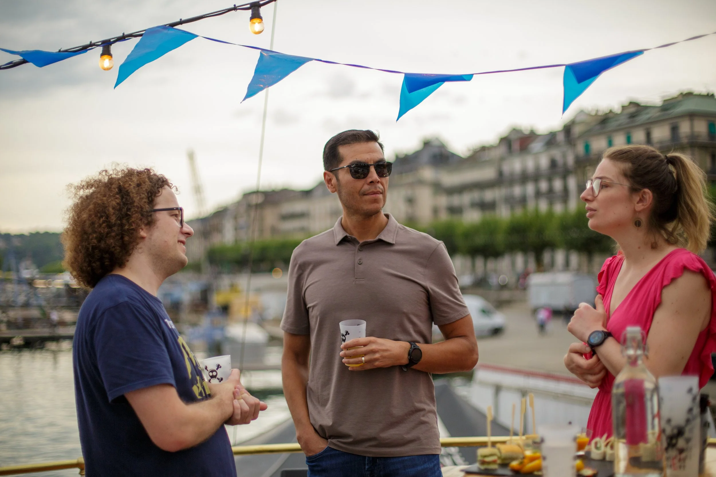 Corporate gathering in Geneva: colleagues networking on deck.