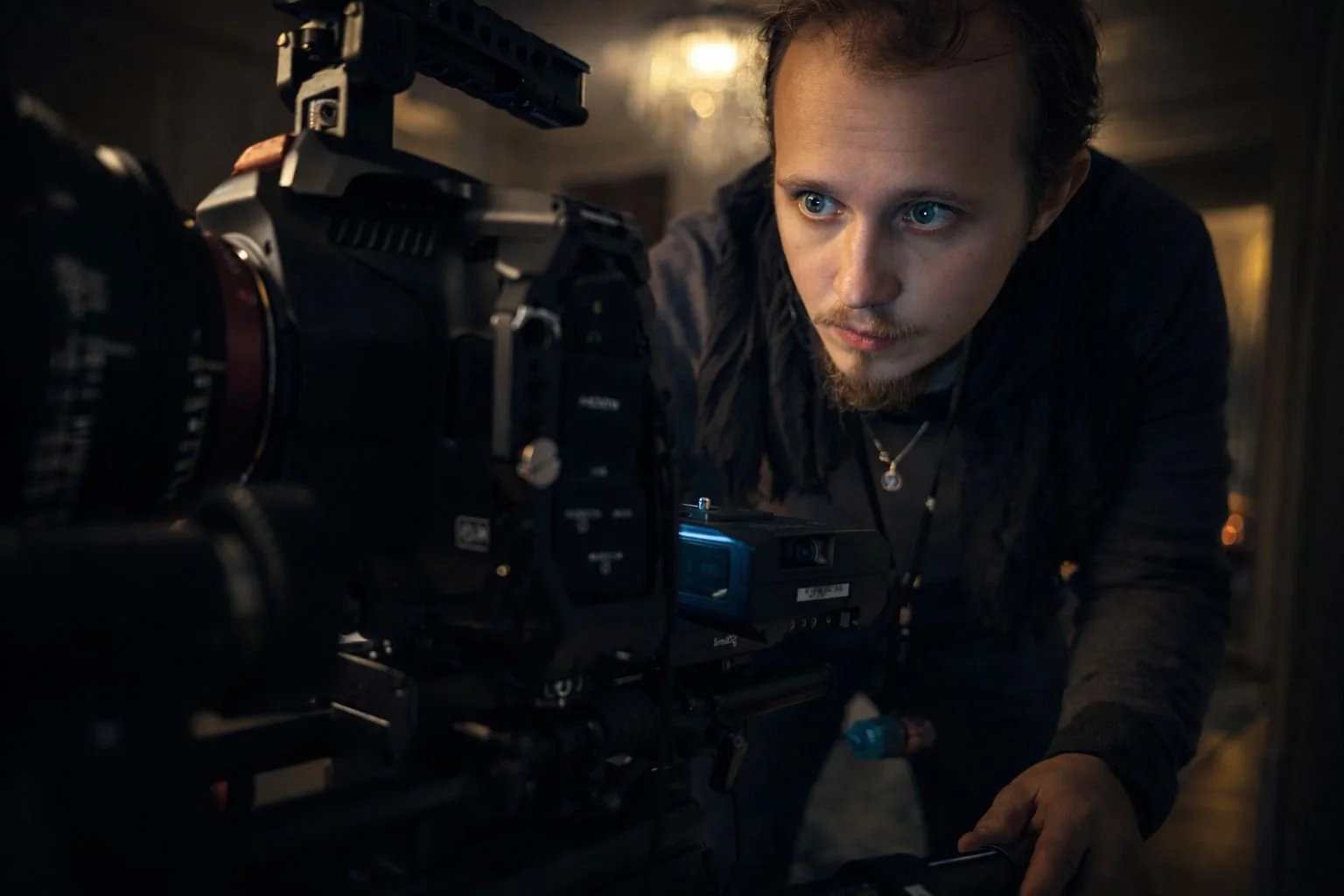 Videographer operating a cinema camera on a professional shoot.