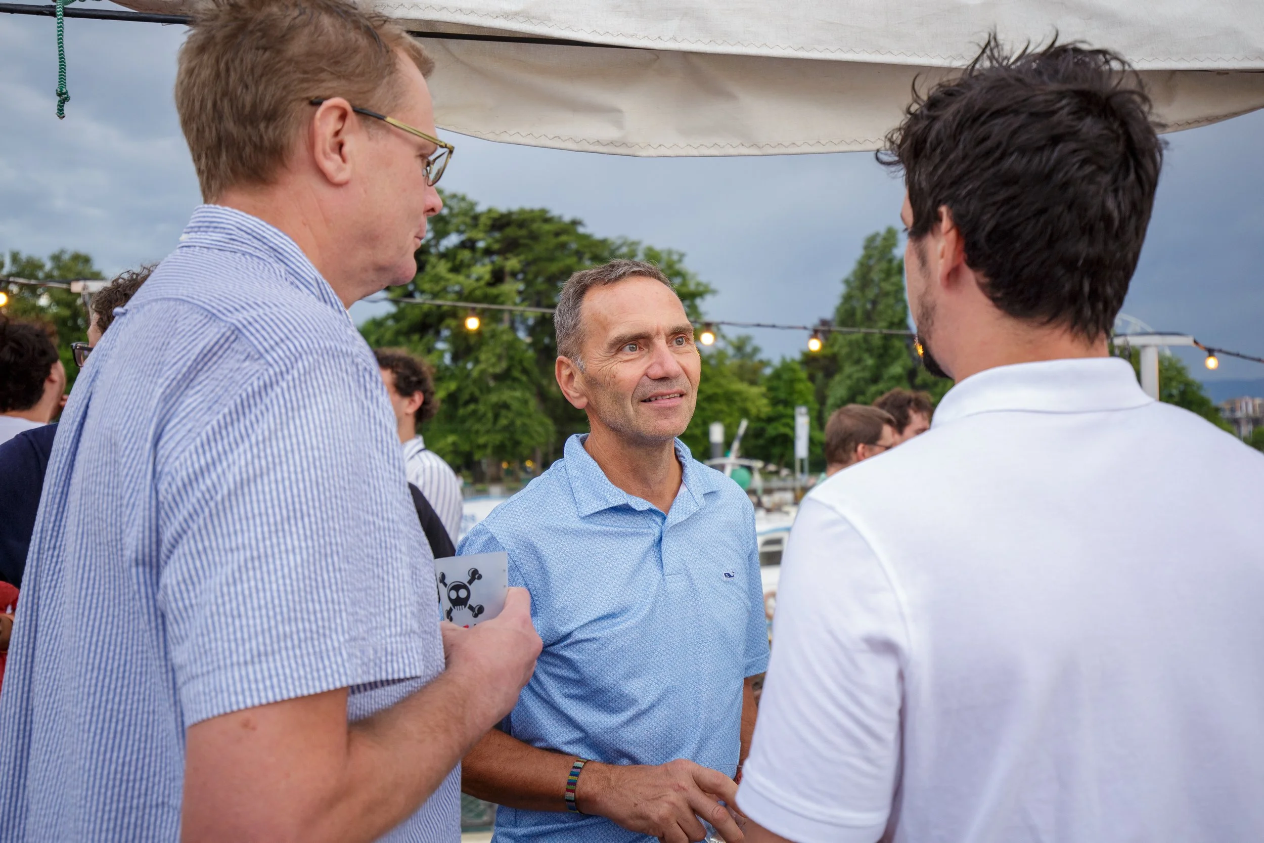 Corporate gathering in Geneva: colleagues talking on deck.