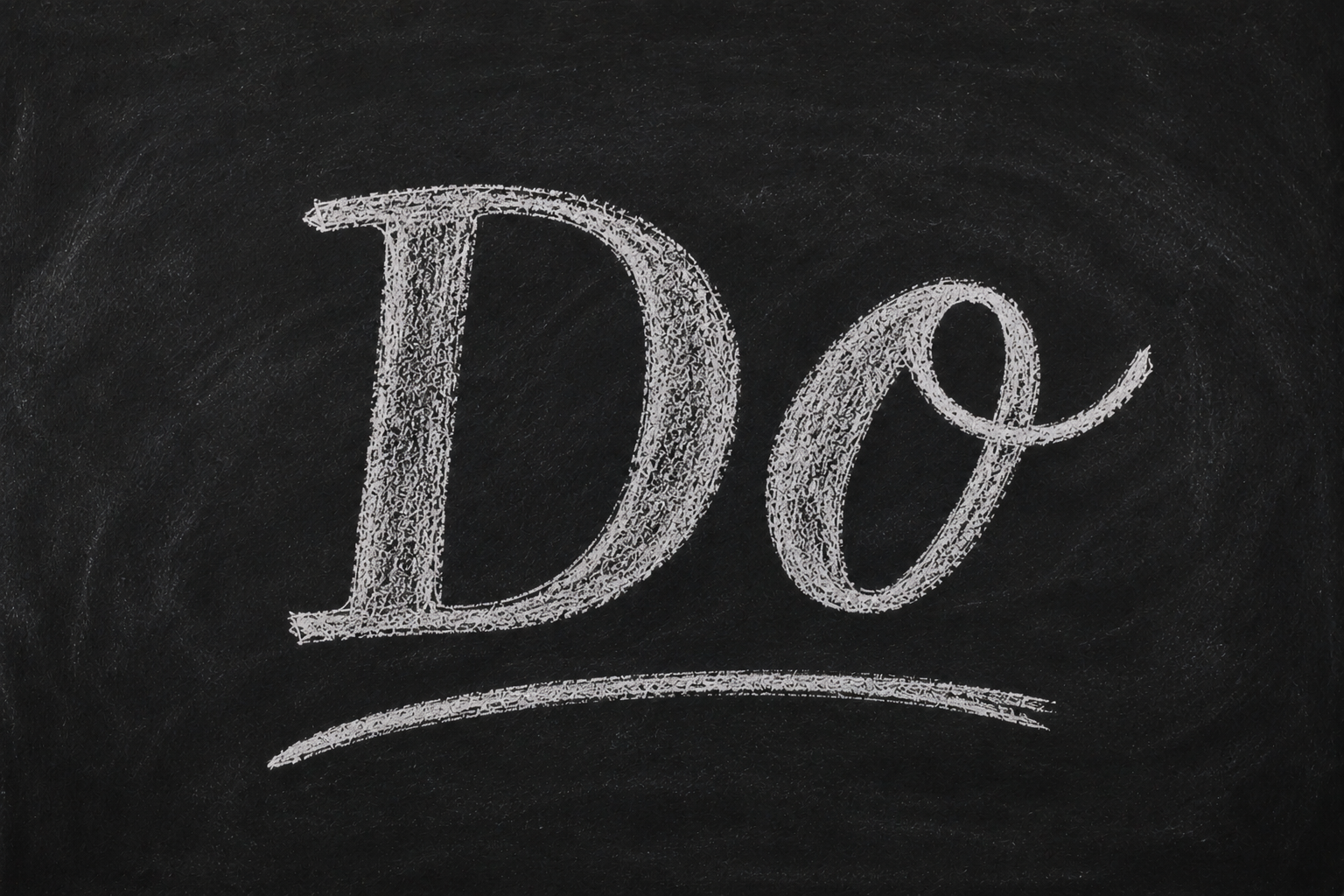 The word "DO" written in white chalk on a blackboard.