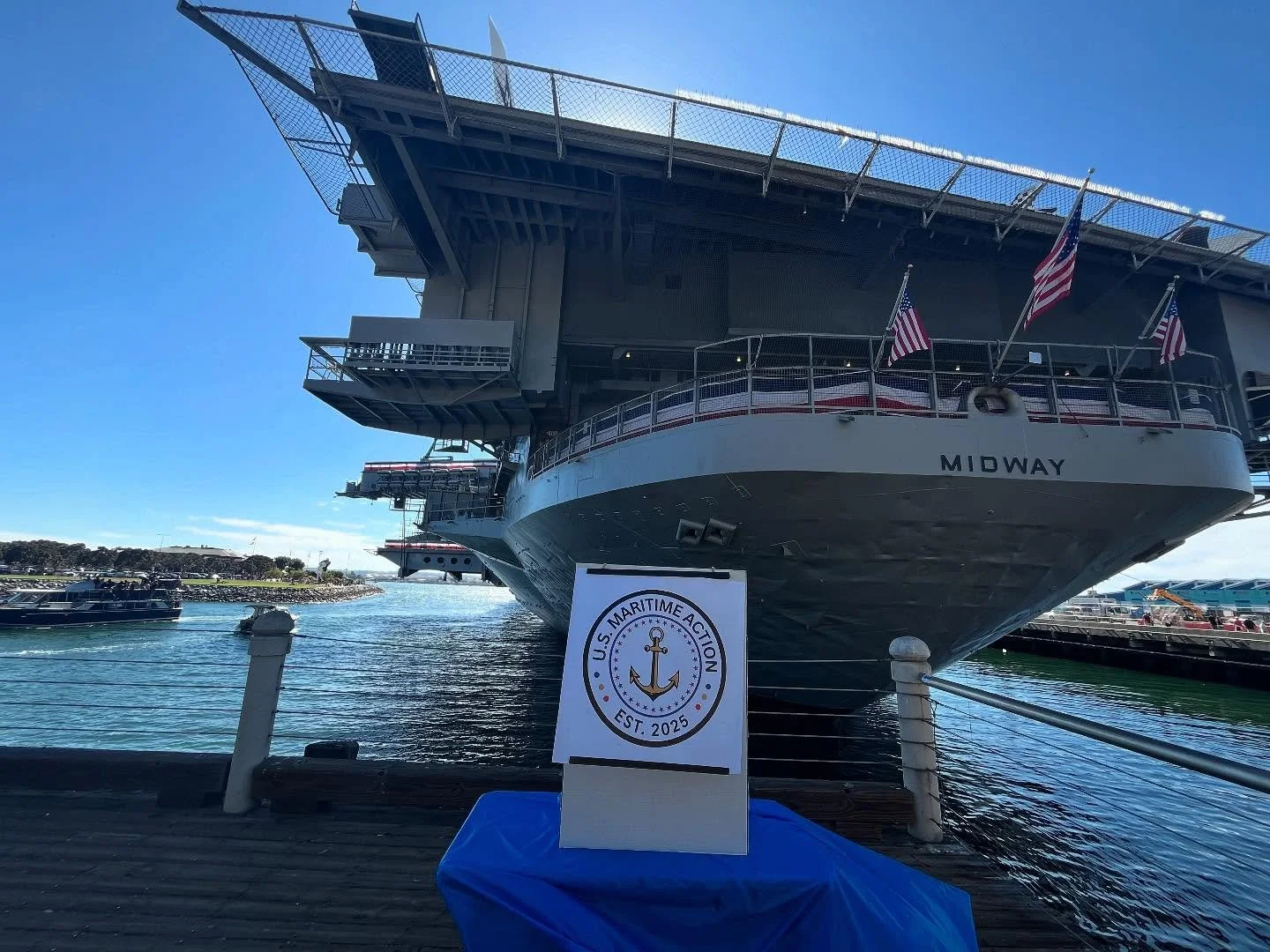 I was setup today at the aft end of USS Midway, CV-41, to spread awareness about the SHIPS (Shipbuilding and Harbor Infrastructure for Prosperity and Security) for America Act. I was there to strike up conversations on the topic with any interested p