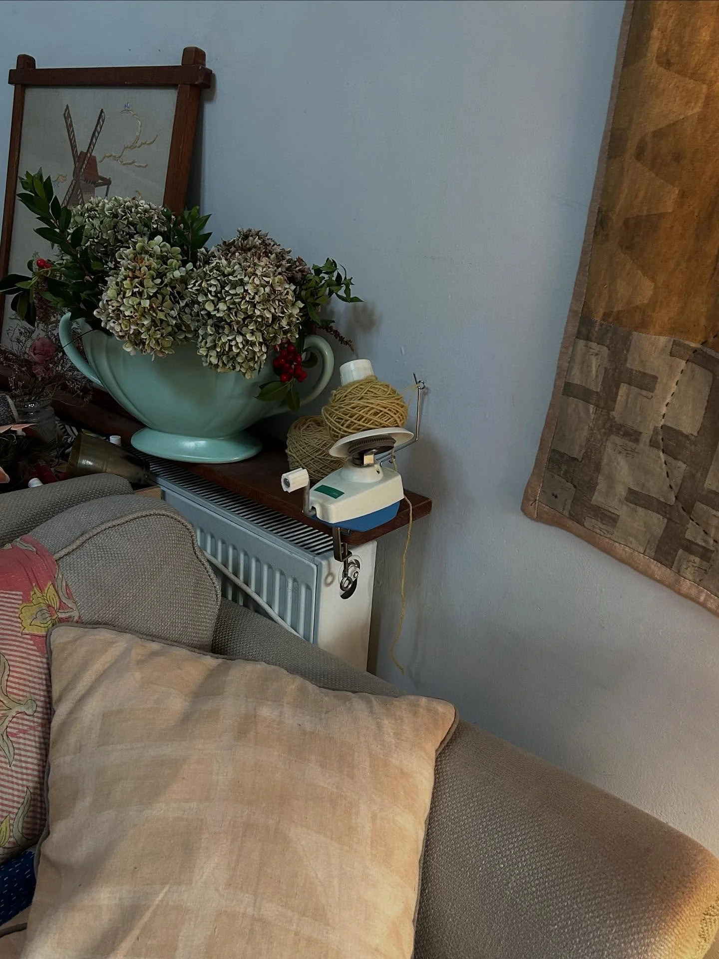 What does your sofa look like ?
Mine is squidgy, second hand (obviously )
And full of Indian kantha quilts , my cushions and my first attempts at winding wool I have dyed with weld.
What you can&rsquo;t see is the tangled wool on the floor which I am