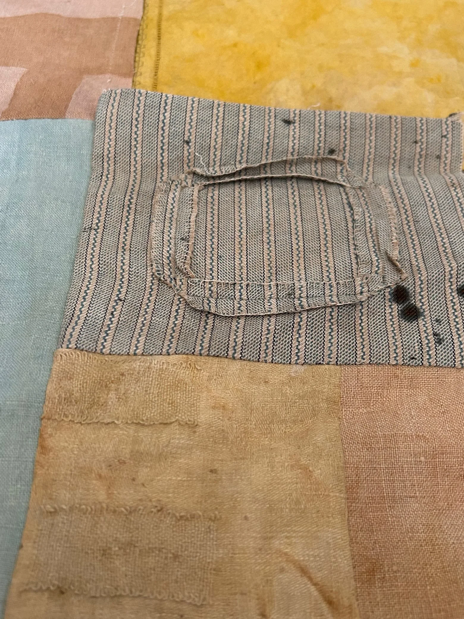 A slightly different quilt is in the making, for an open call. It is using 3 small pieces of stitching which a young girl did in 1930's for a school competition.
Unfortunately one piece didn't survive the stitching process and had to be replaced, but