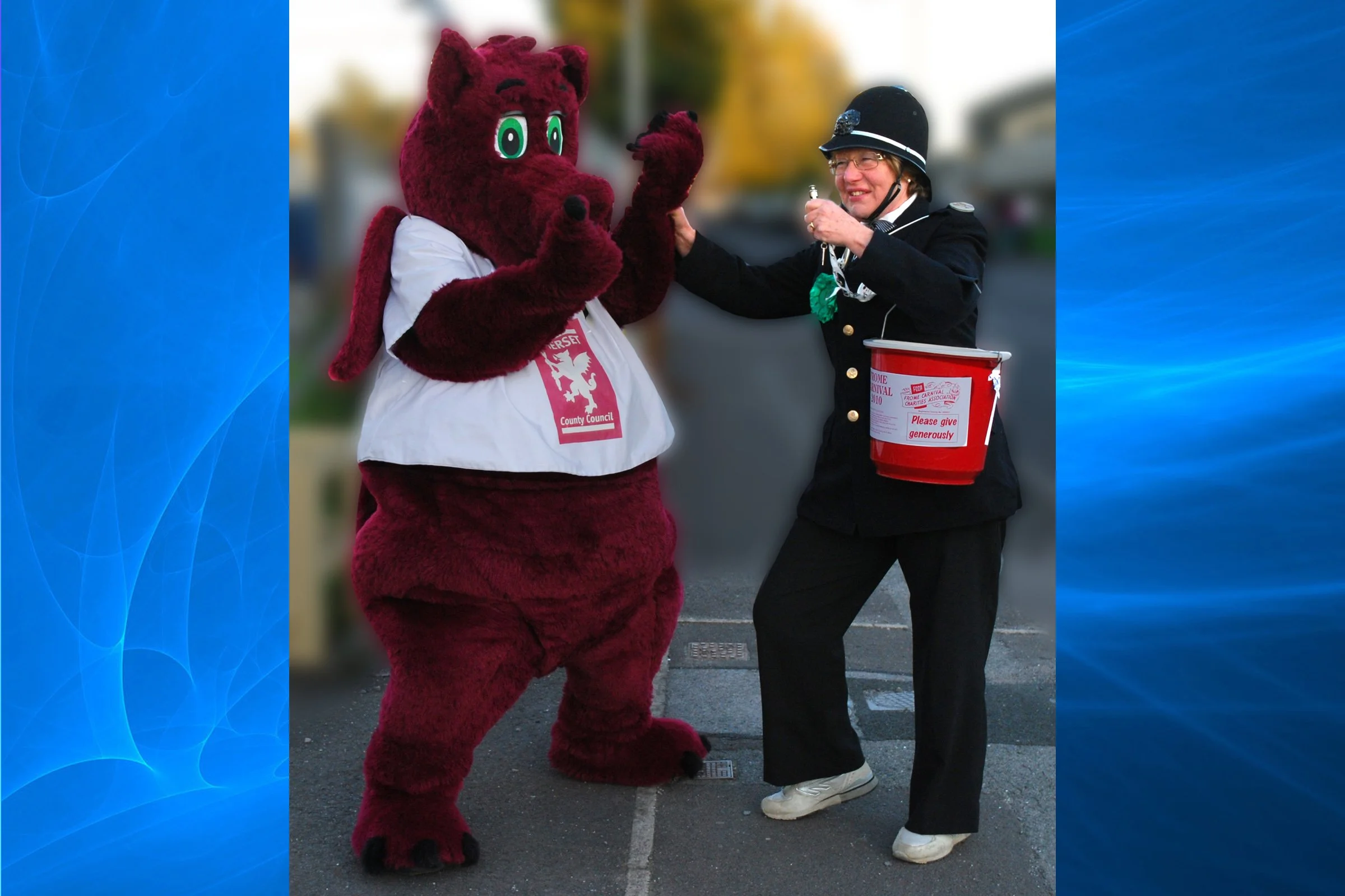 Sparky The Somerset Dragon promoting carnivals and being arrested by a local copper!