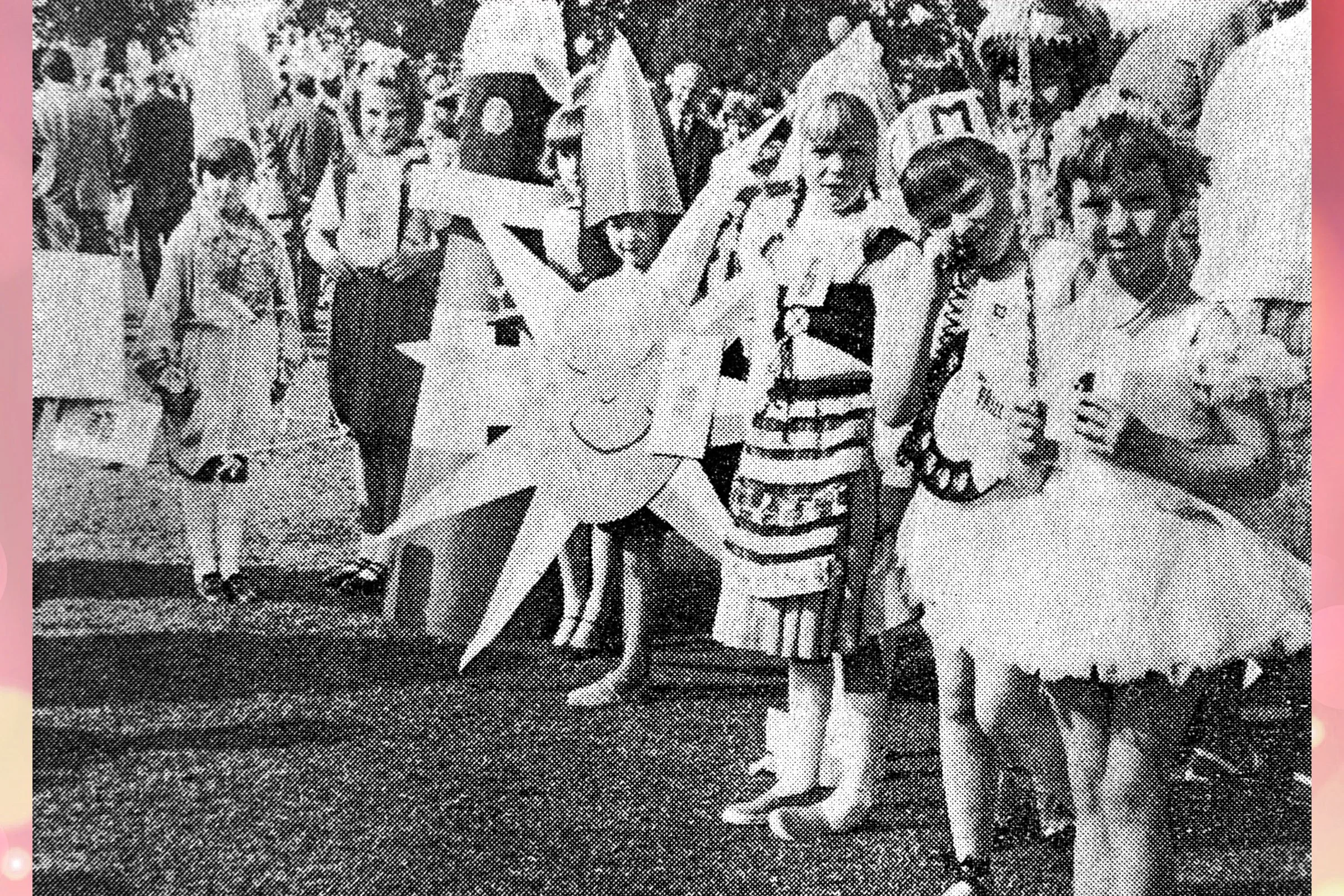 A Group of Children's entries being judged in the park