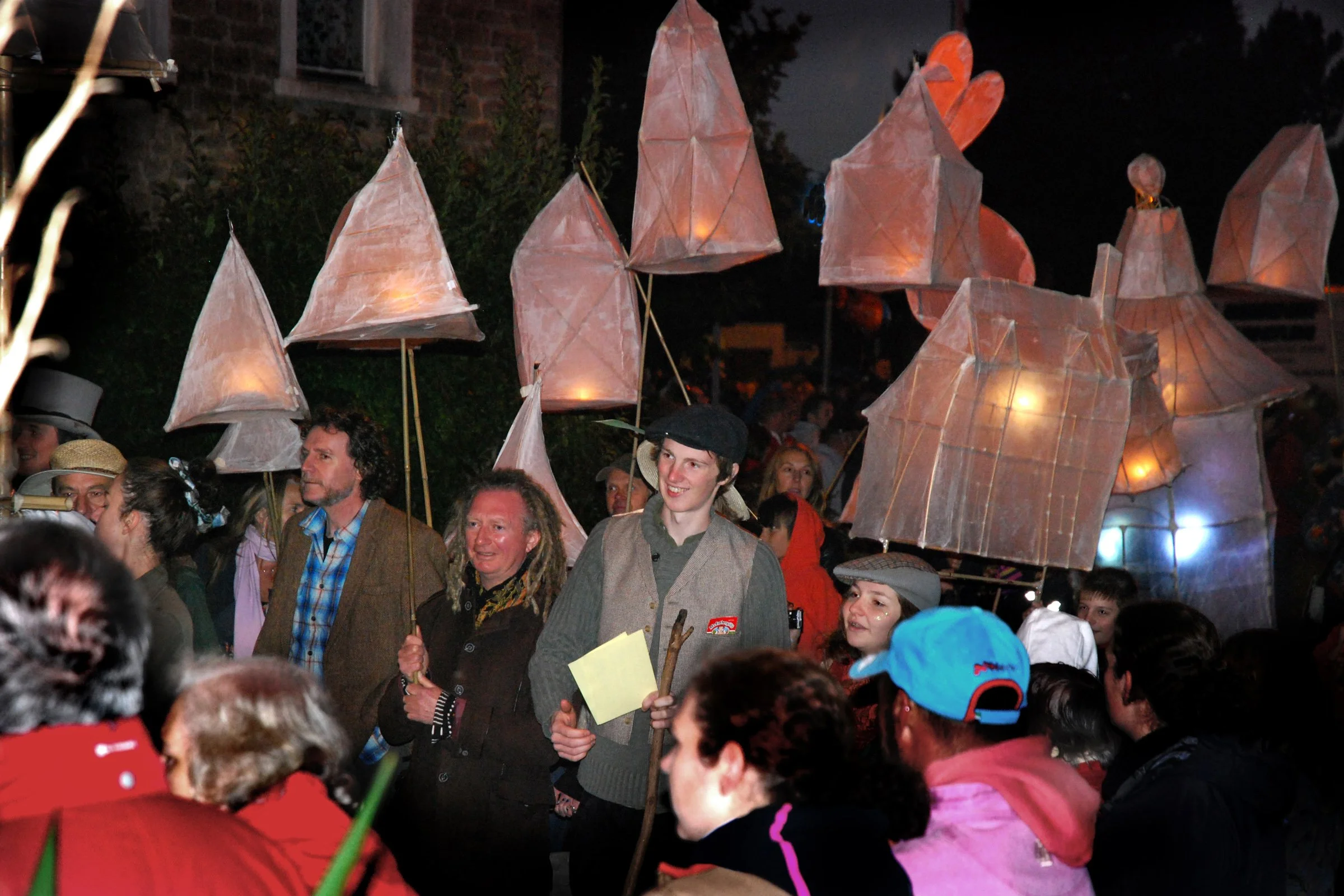 Mayor surrounded with lit lanterns
