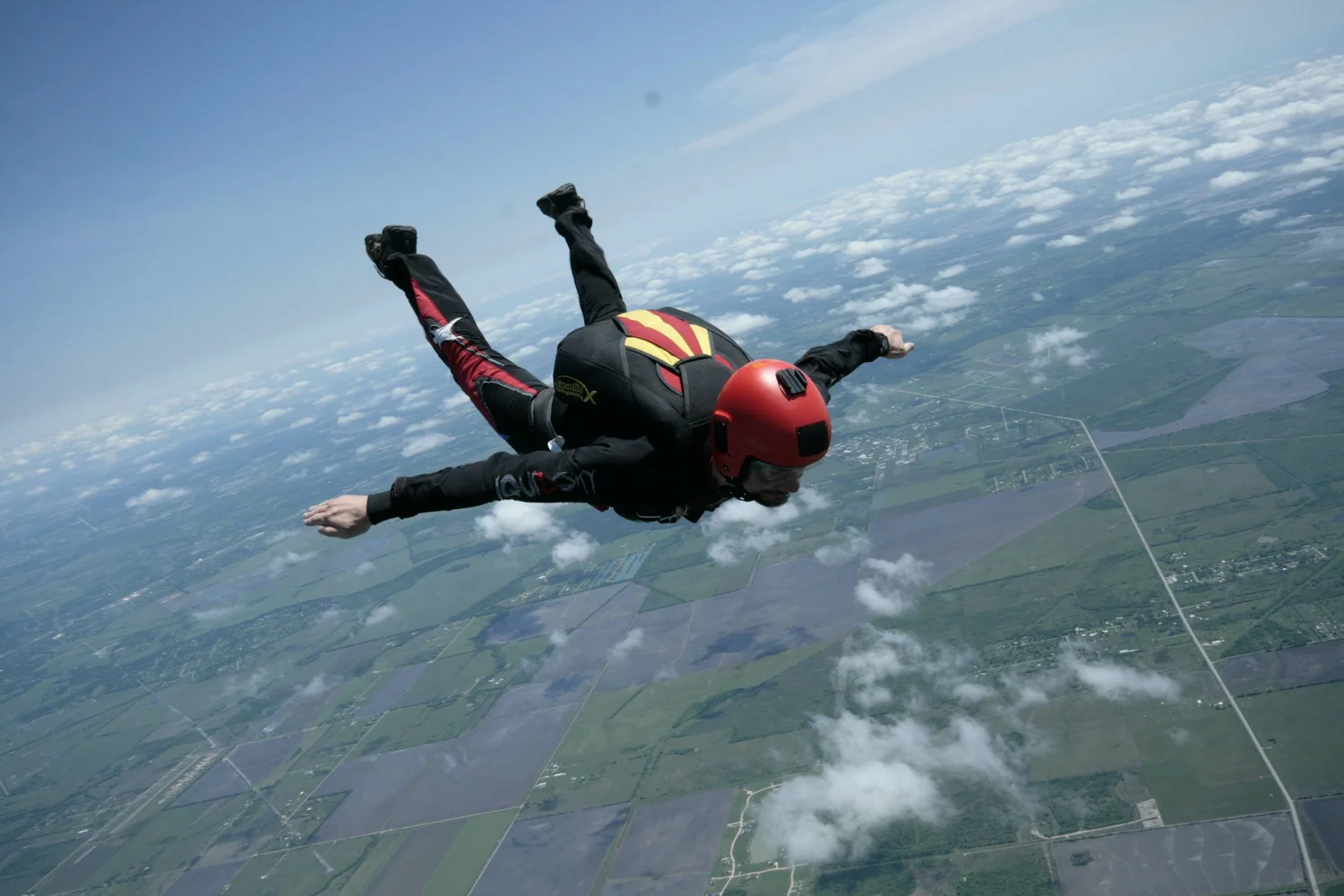 Skydiver performing delta track