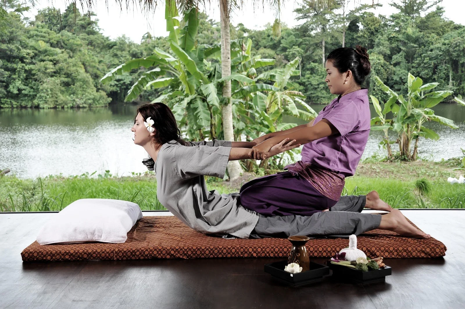 Beautiful Thai spa setting, outdoor yoga, tropical wellness space, or traditional Thai massage.