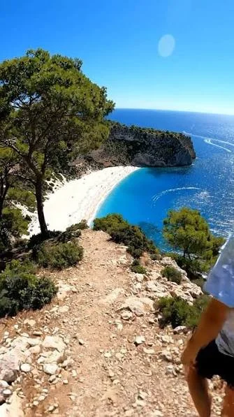 Dramatic Mallorca cove with turquoise water and limestone cliffs, or a beautiful stone village in the Tramuntana Mountains.