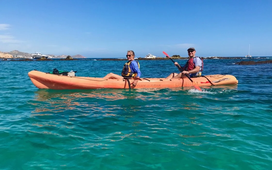 two people on a kayak in the ocean