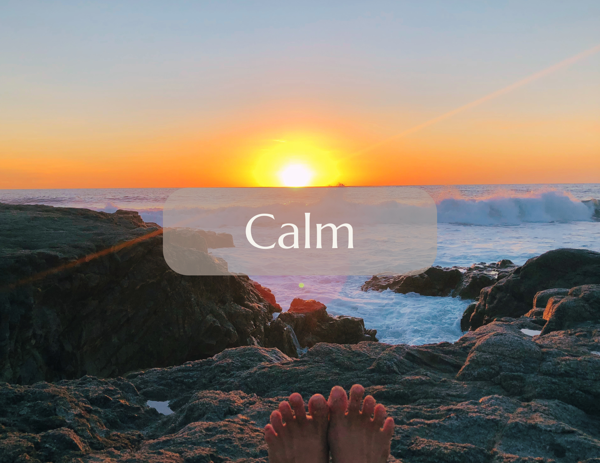 Person relaxing on rocky shore at sunset with the word 'Calm' overlaid