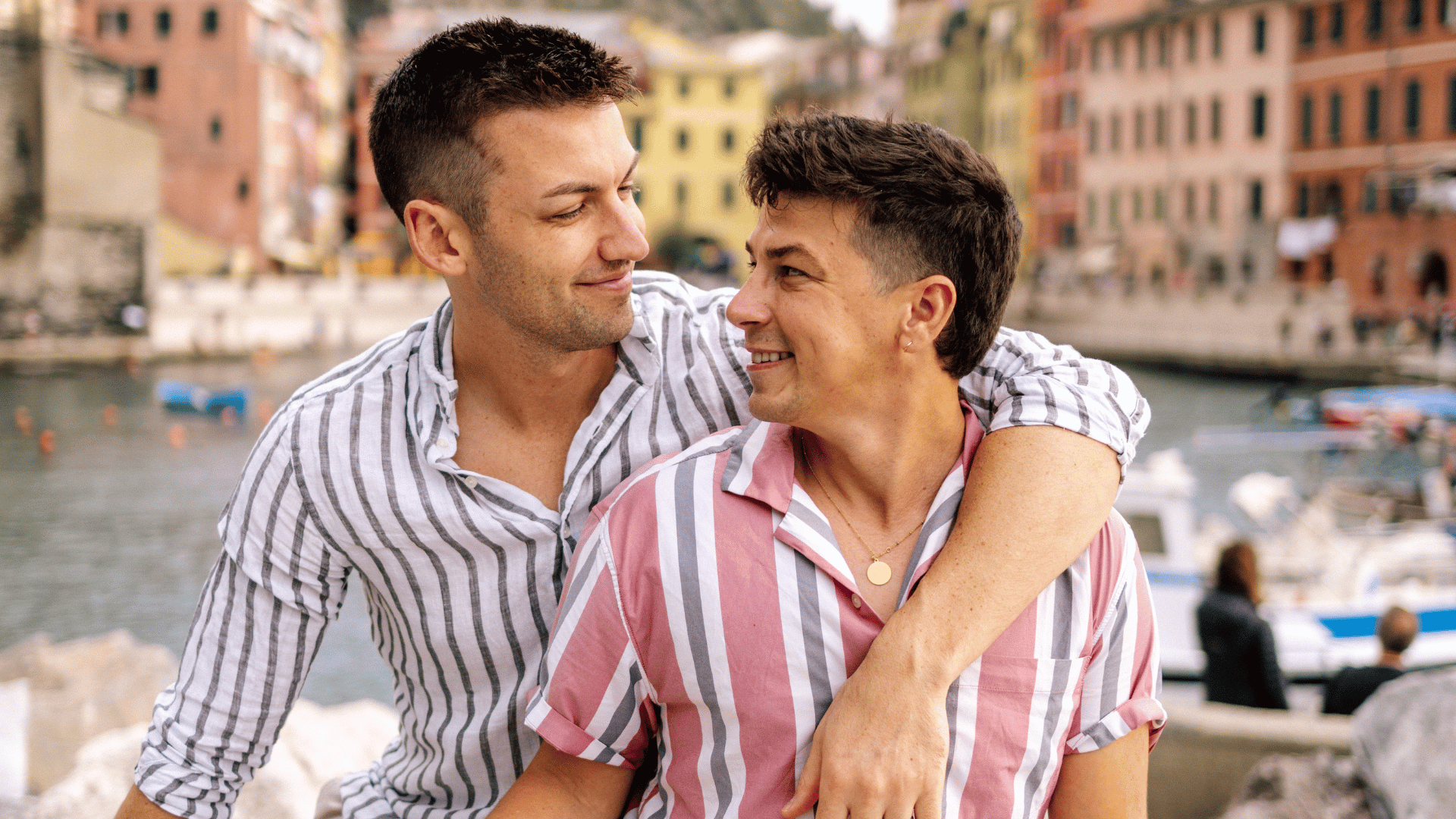 Two guys arm in arm in Italy