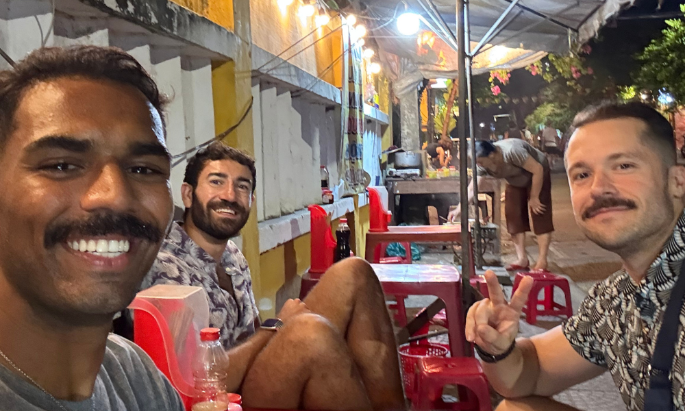 3 guys eating street food in Vietnam