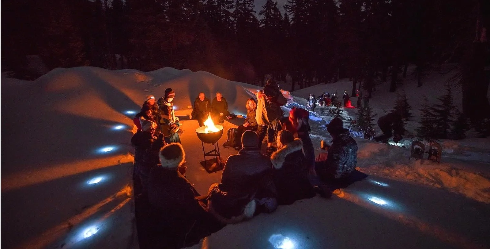 People at a campfire in the snow