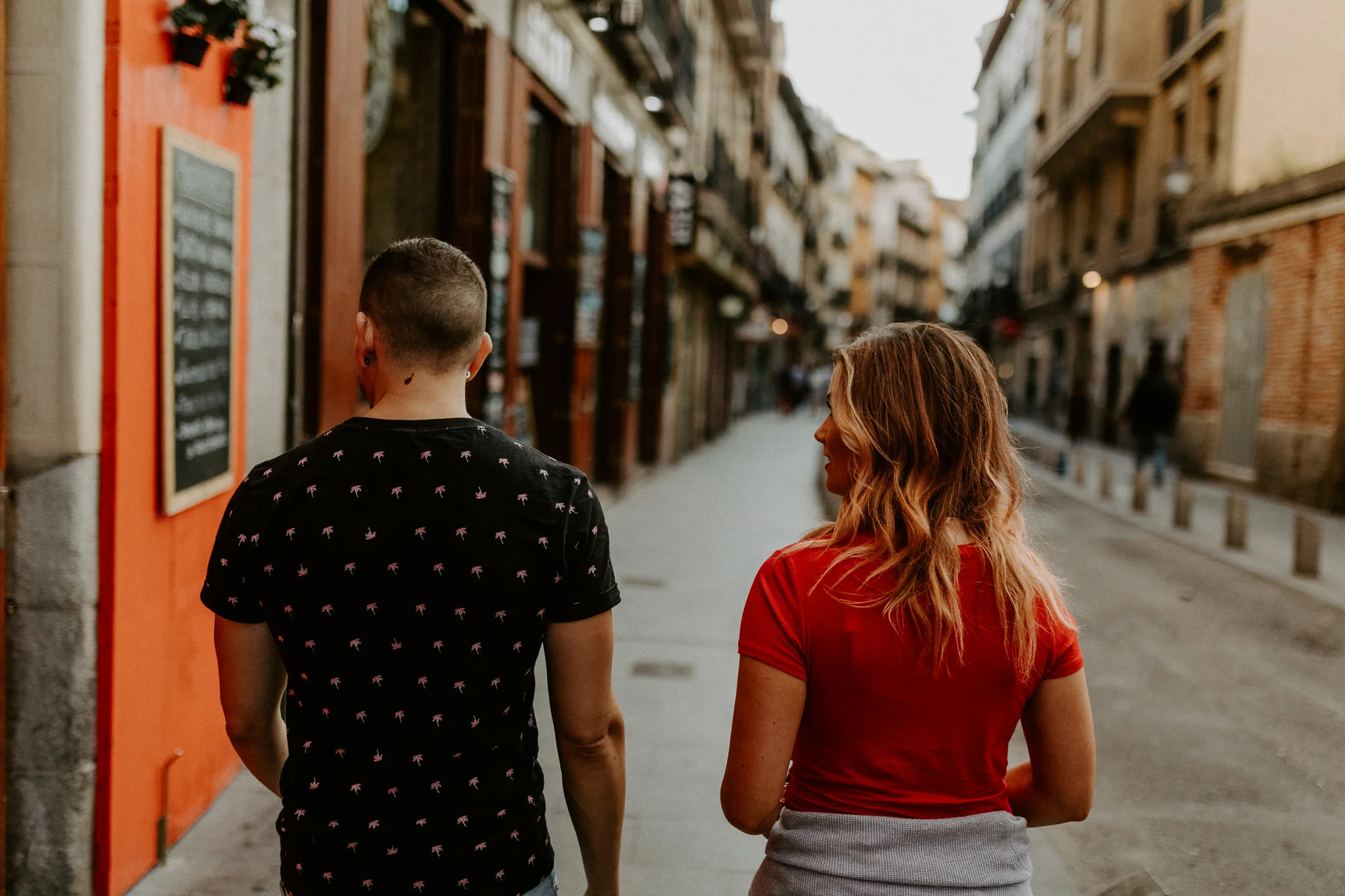 Walking down Calle de la Cava Baja tapa street in Madrid Spain
