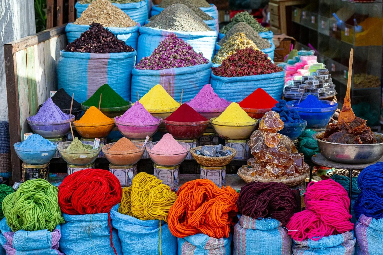  Colorful spice pigments and dyed wool in the Marrakech spice souk 