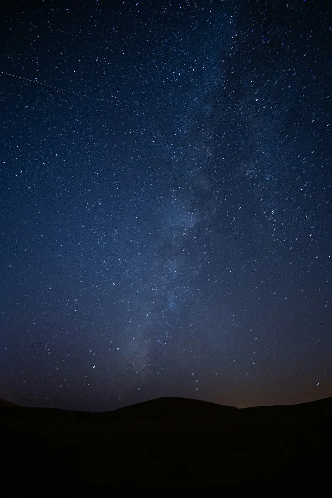  The Milky Way over the Sahara Desert dunes near Merzouga, Morocco 