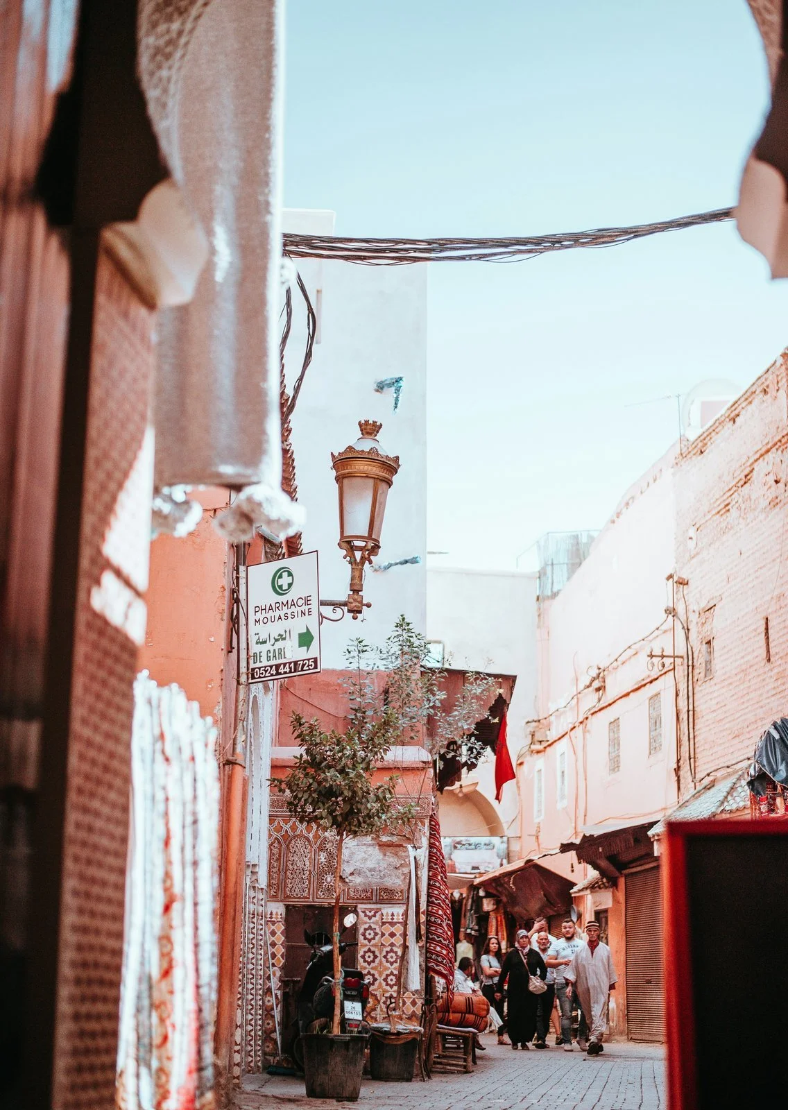  A narrow street in the Marrakech medina lined with shops and a pharmacy 
