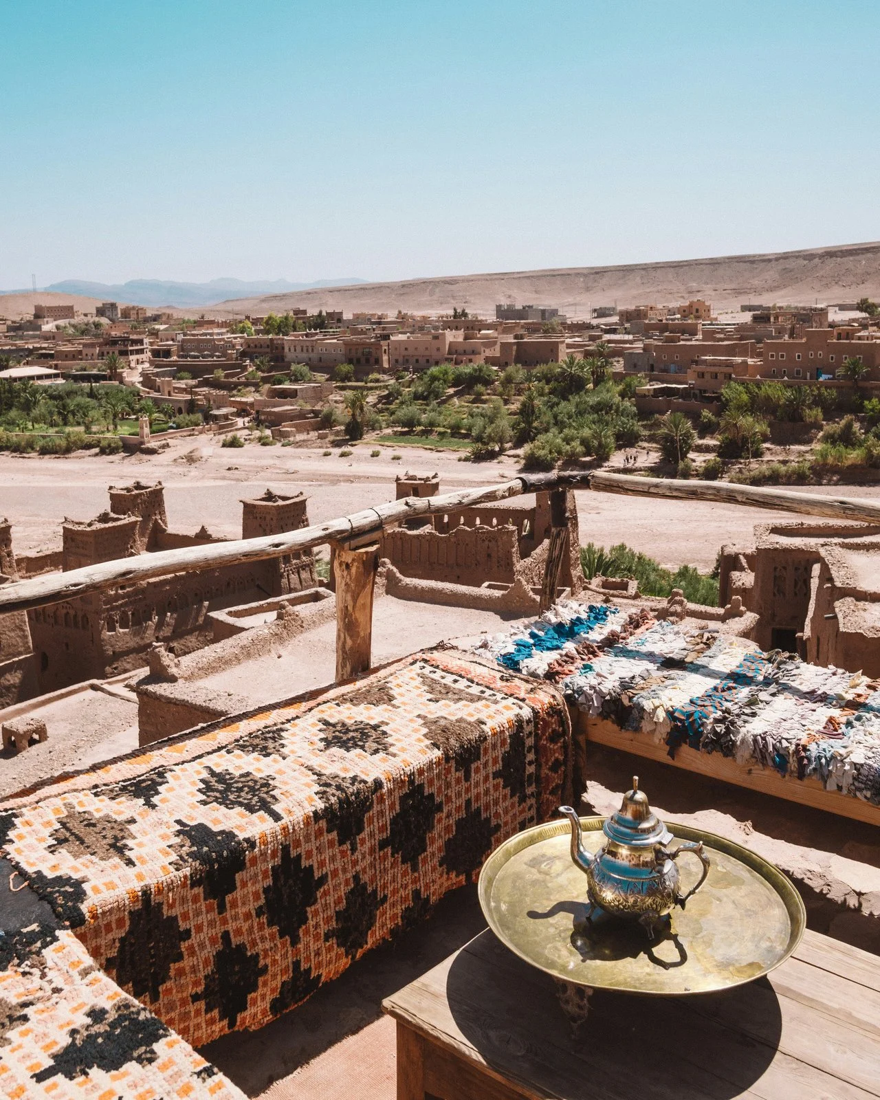  A rooftop mint tea set overlooking the Ait Ben Haddou kasbah and oasis in Morocco 