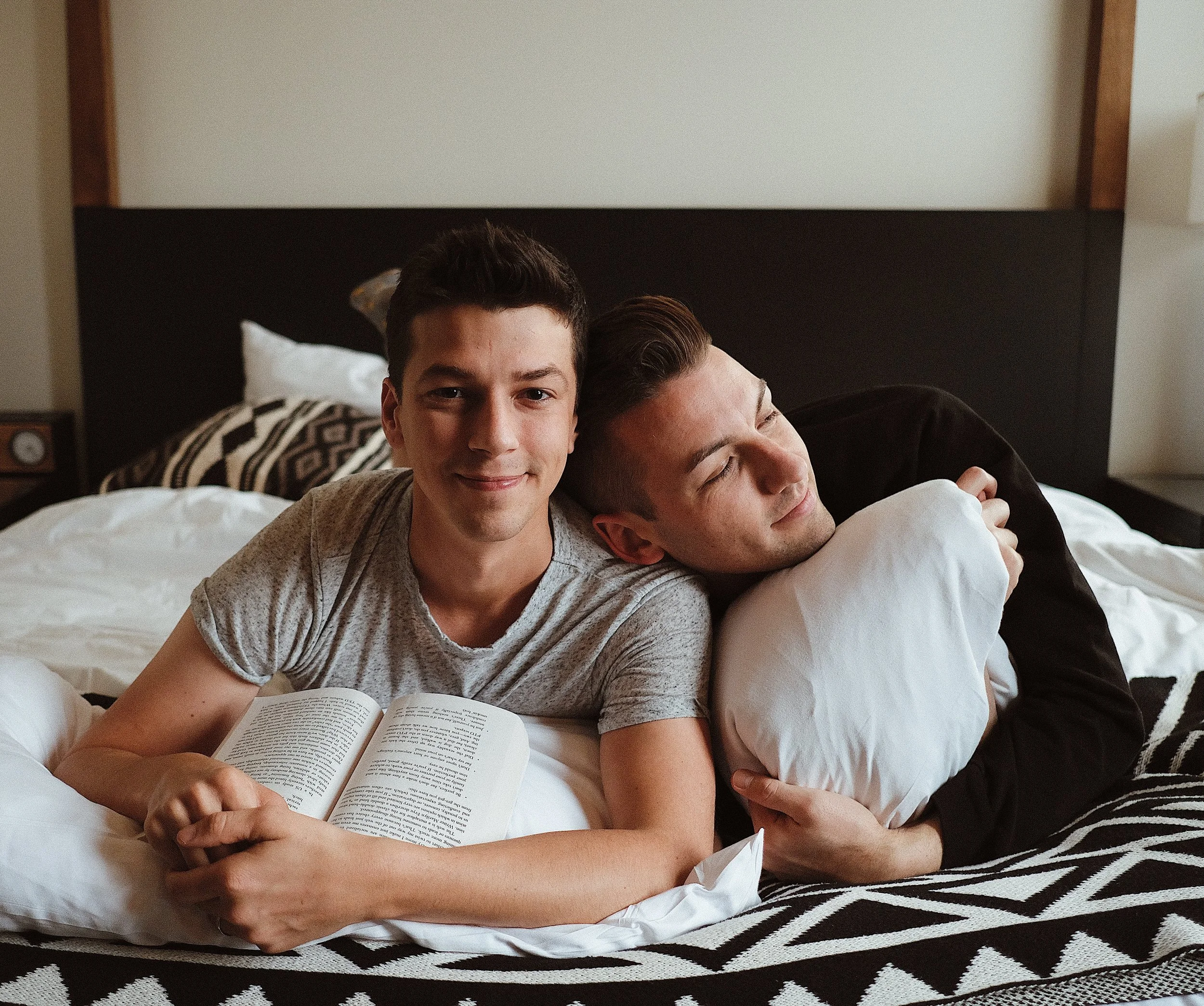 Michael and matt on a bed with books