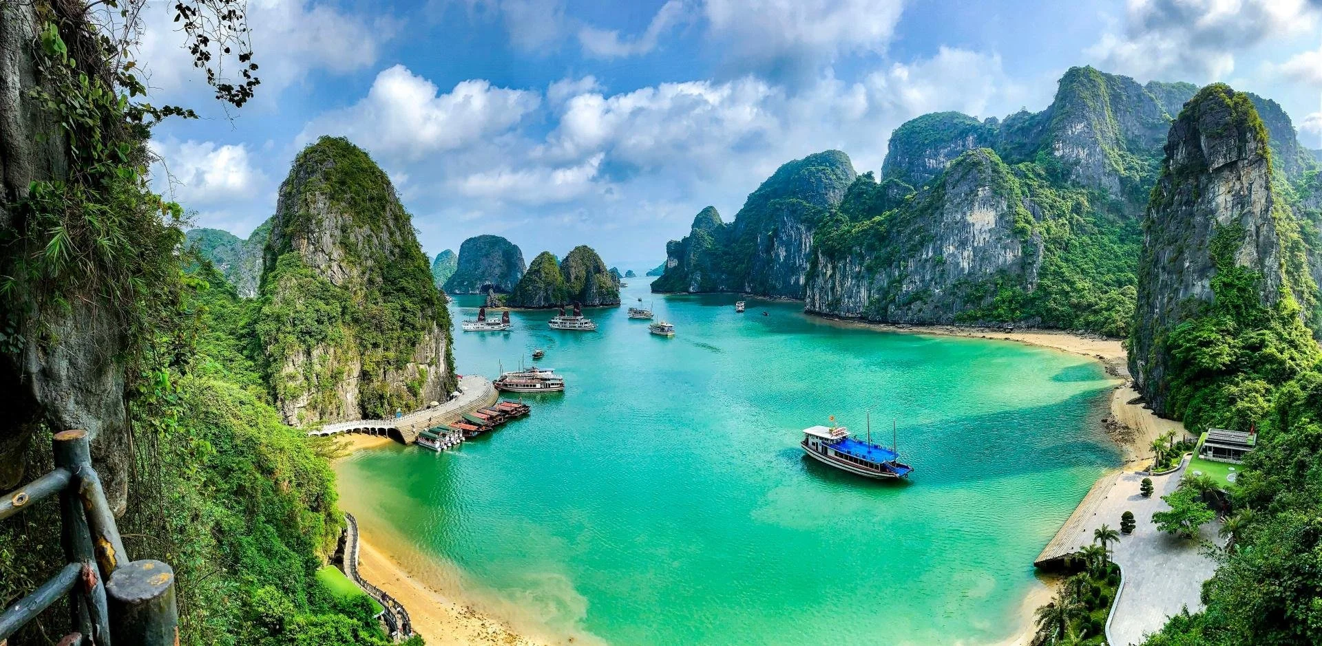 panorama view of ha long bay with turquoise water and boats sailing