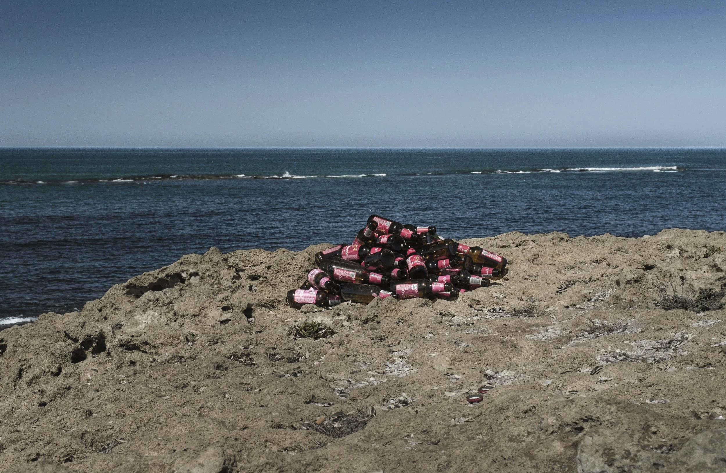 Bottles on Beach, Morocco, 2025. Rana A Fine.