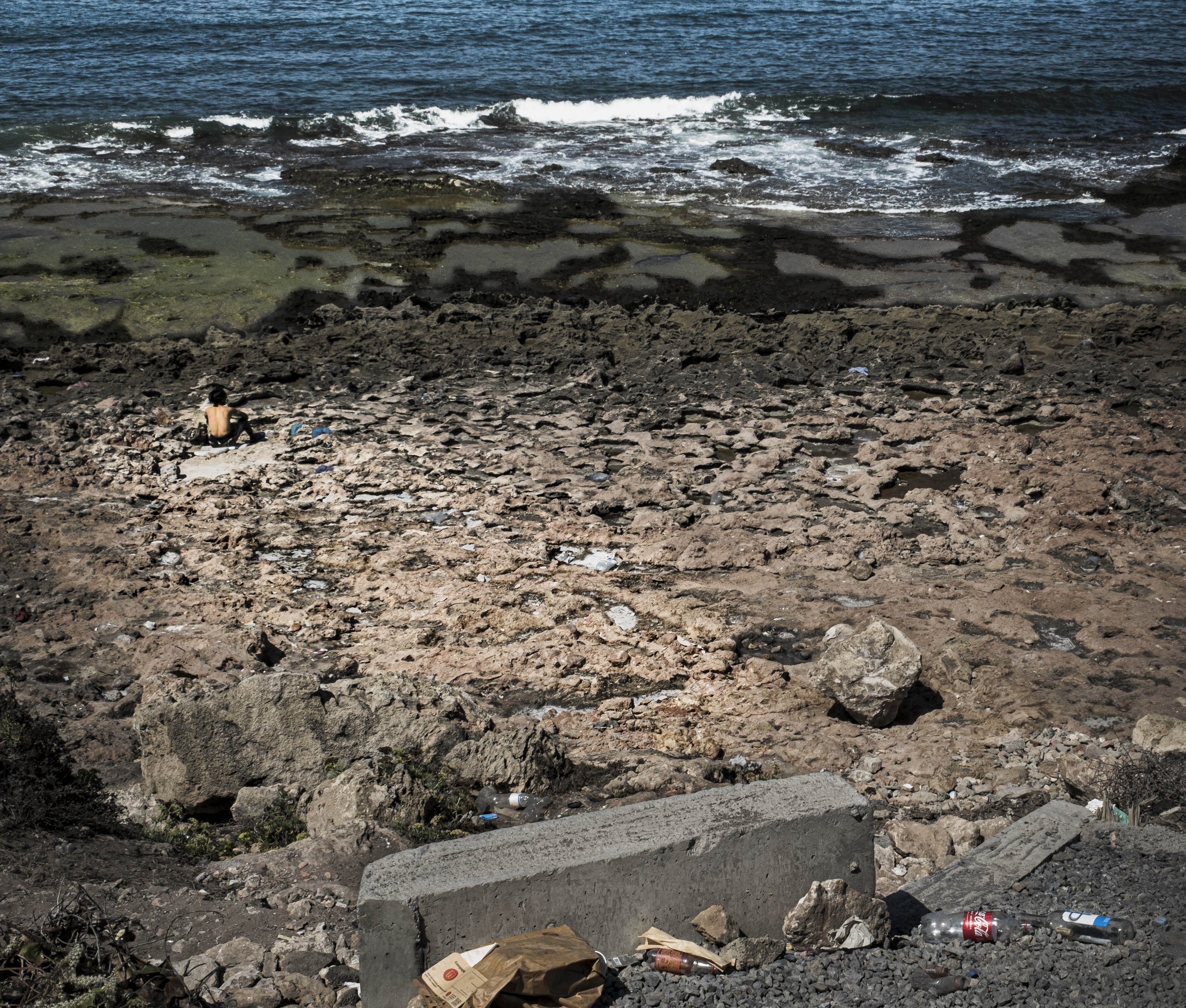 Debris on Beach With Man, Morocco, 2025. Rana A Fine.