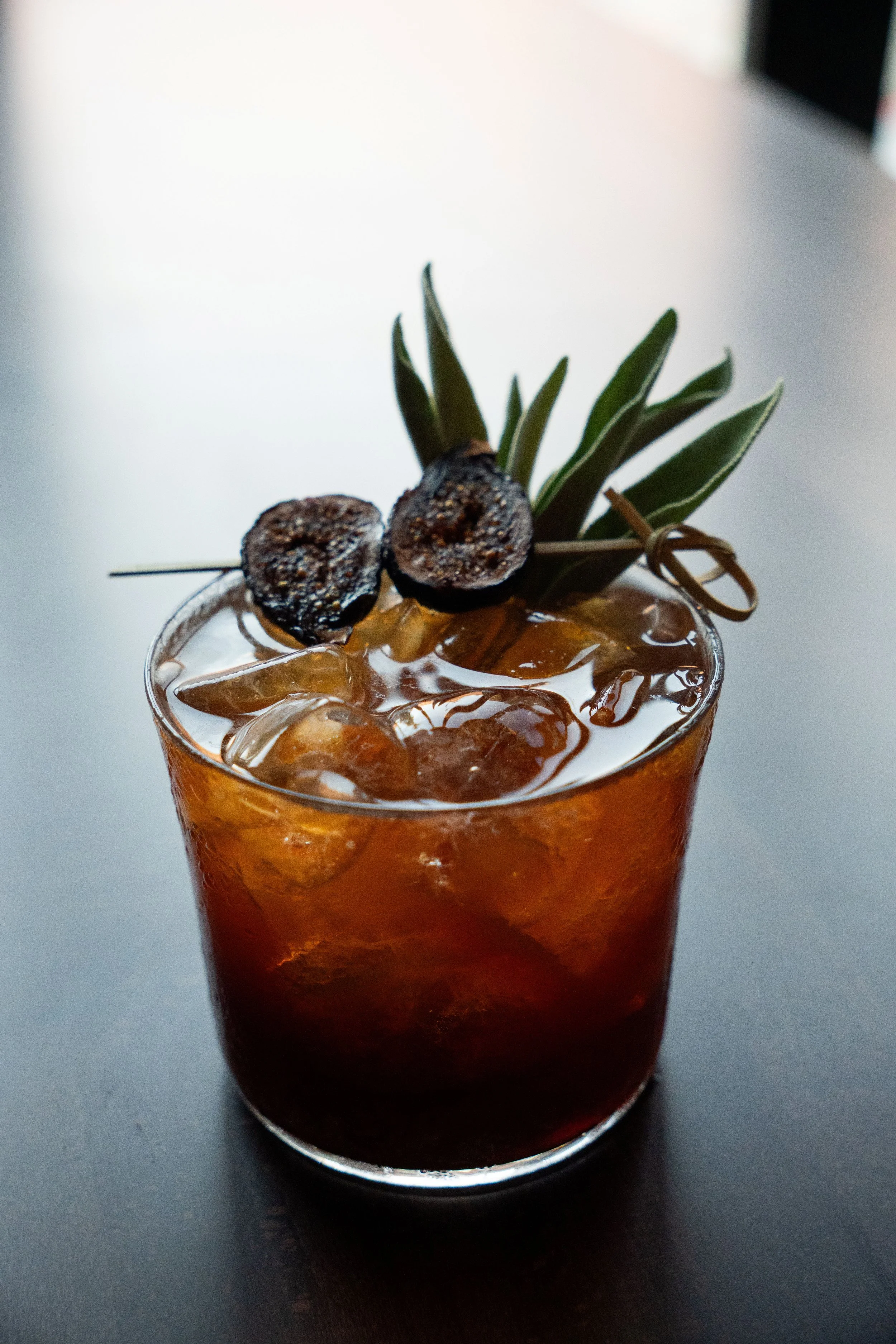 Untitled #847 at Gunny’s Pub is a rich, savory bourbon cocktail made with goat cheese fat-washed bourbon, Averna, rye, a house vermouth blend, fig-sage balsamic shrub and honey. Finished with fig and herbs, it’s an earthy, layered original from our L