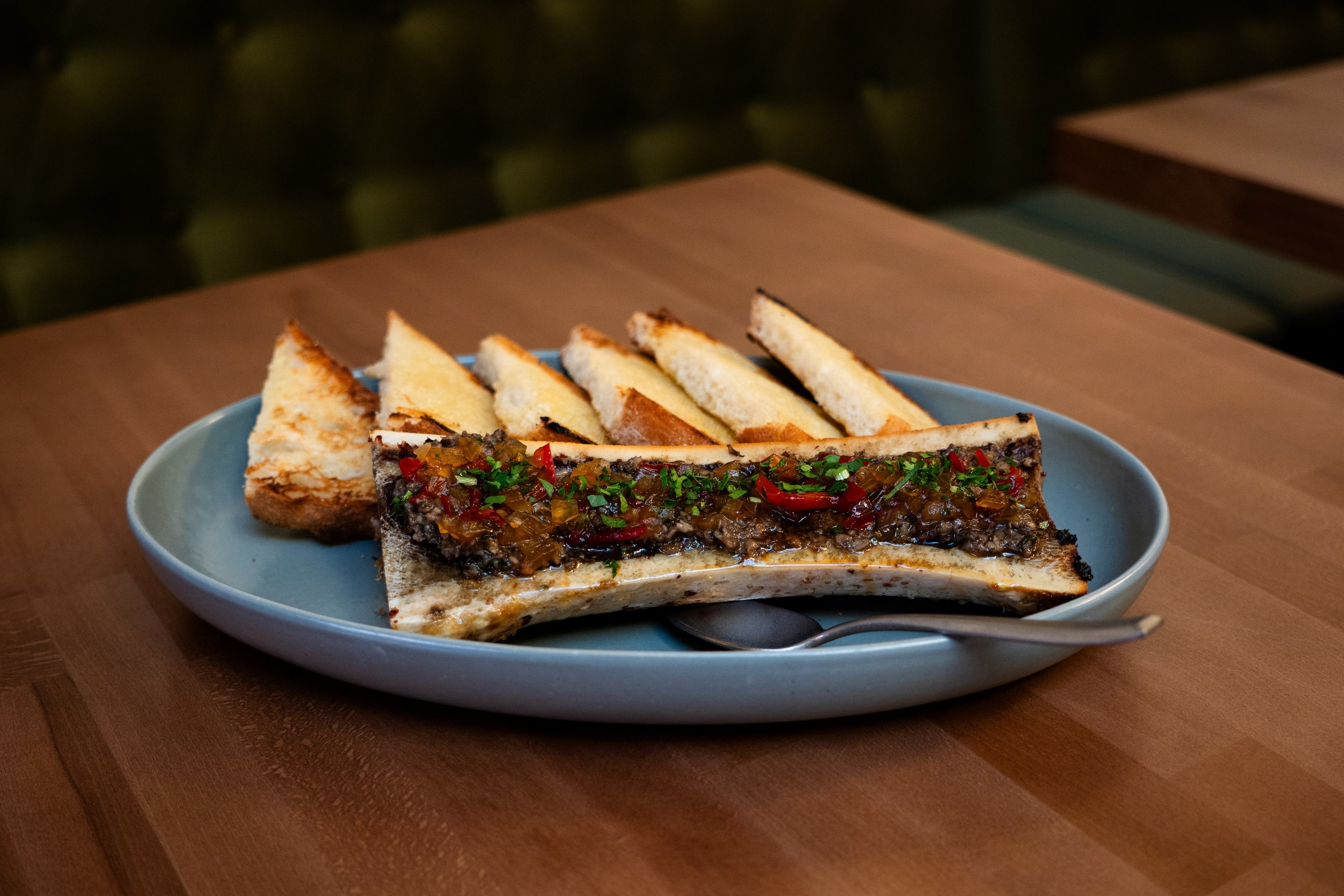 Roasted bone marrow at Gunny’s Pub, served with deeply savory mushroom XO, sweet-savory onion honey jam, sea salt and toasted sourdough for getting every last bit. One of the more ambitious “show-off” dishes on our Lincoln Park dinner menu.