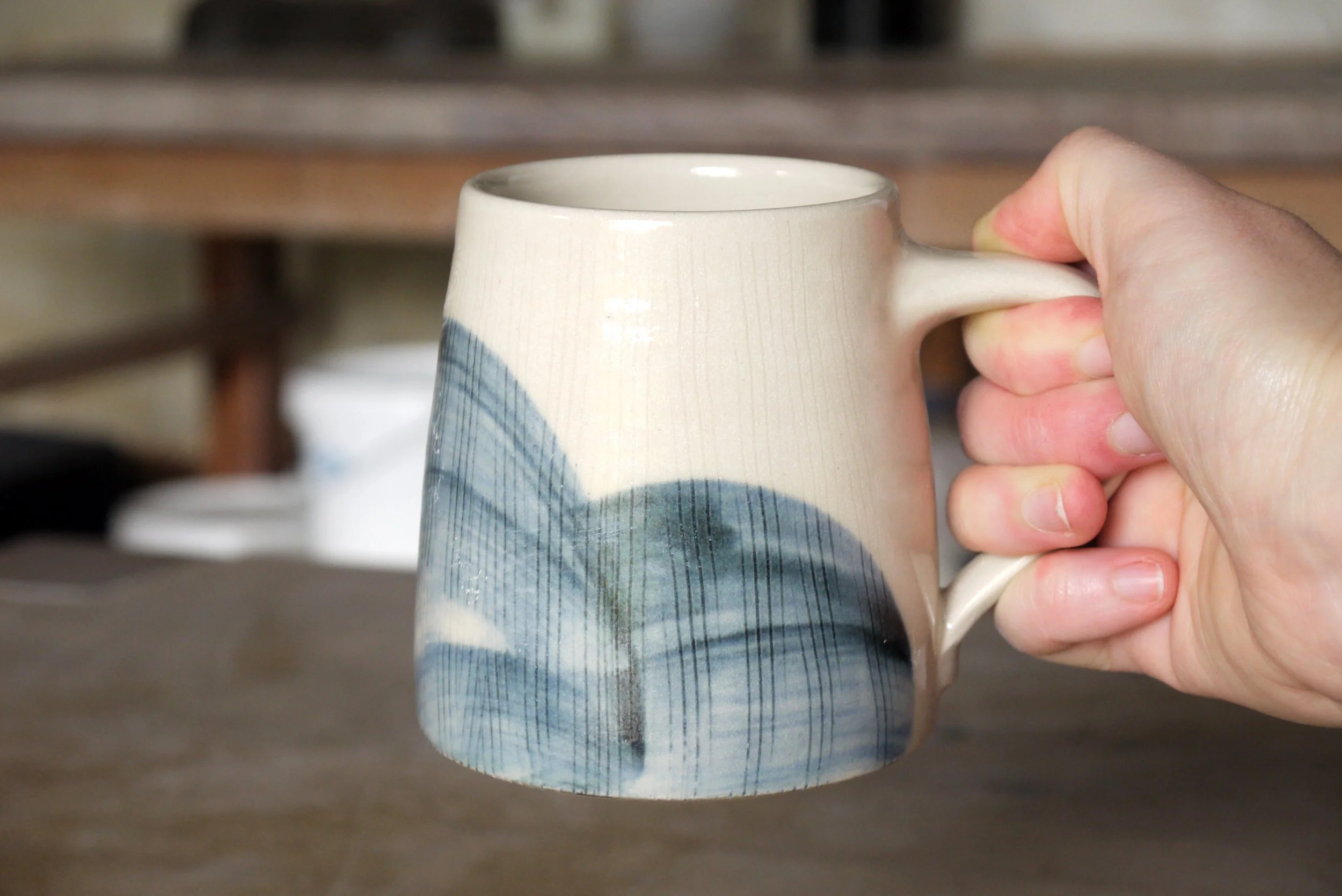 Fields large tea mug in a hand.JPG