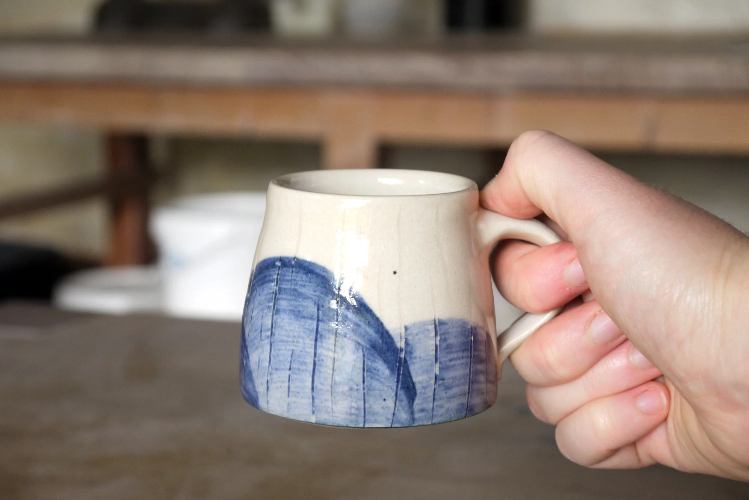 Fields Espresso mug in a hand.JPG