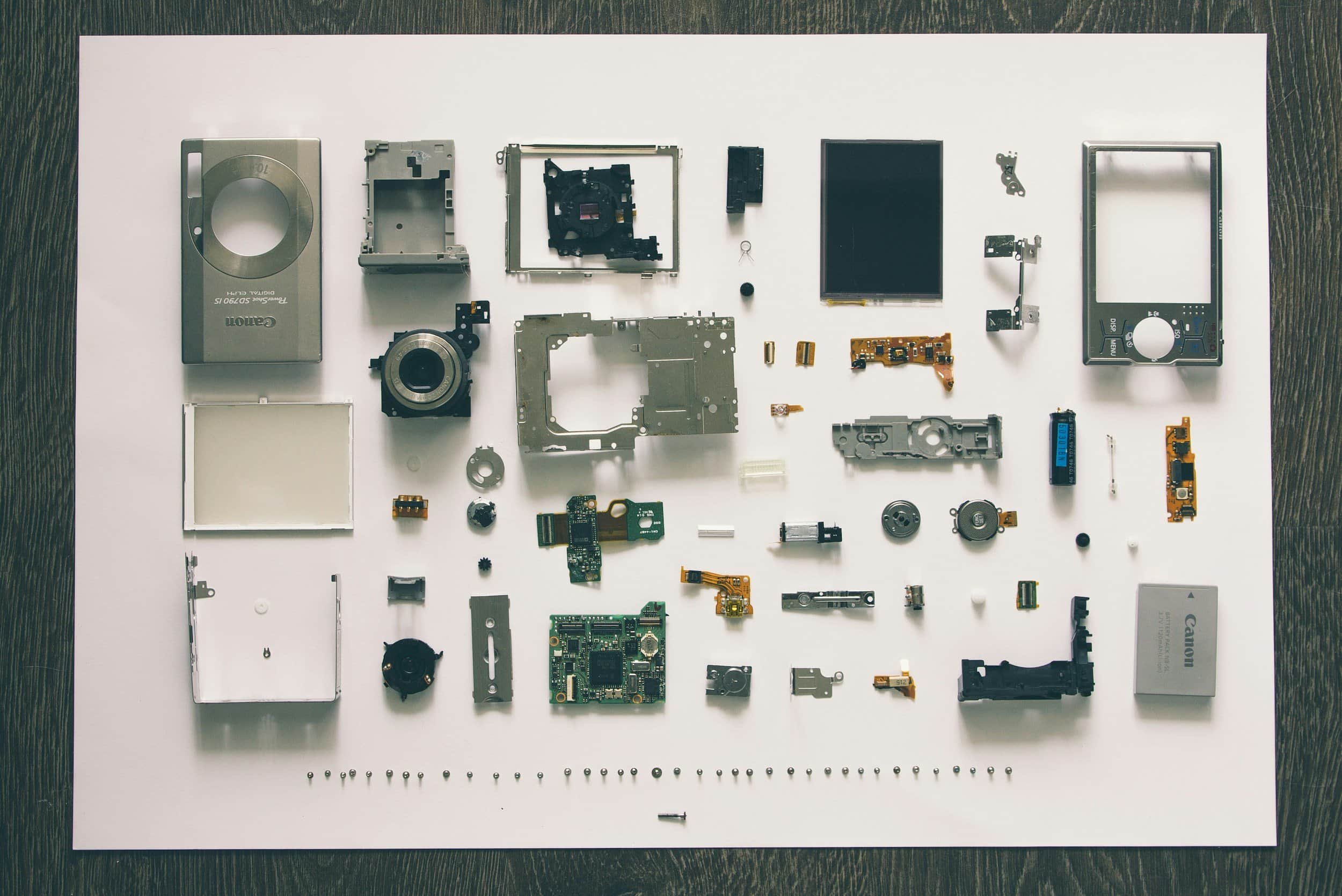 Disassembled electronic device components organized for design analysis