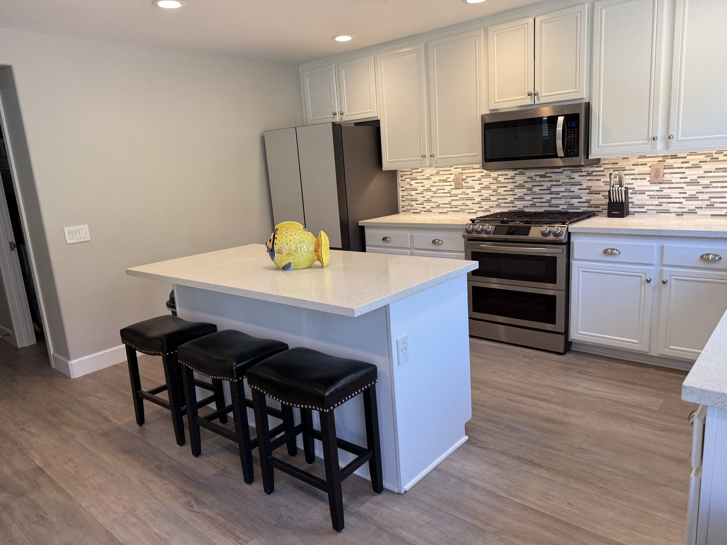 Home for sale with a modern kitchen with white cabinets, stainless steel appliances in Castaic California Los Angeles County five bedroom