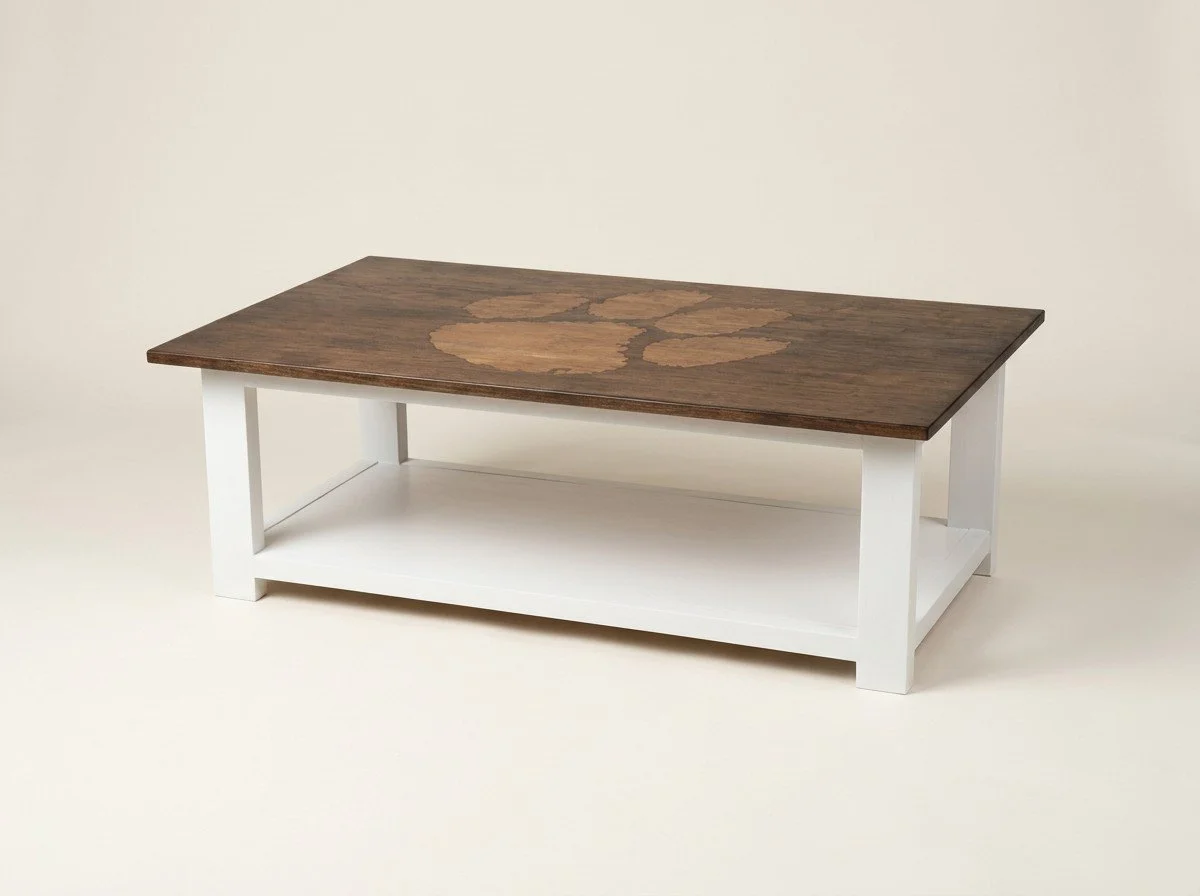 Custom coffee table with inlaid tiger paw by Saluda Dog Woodworks