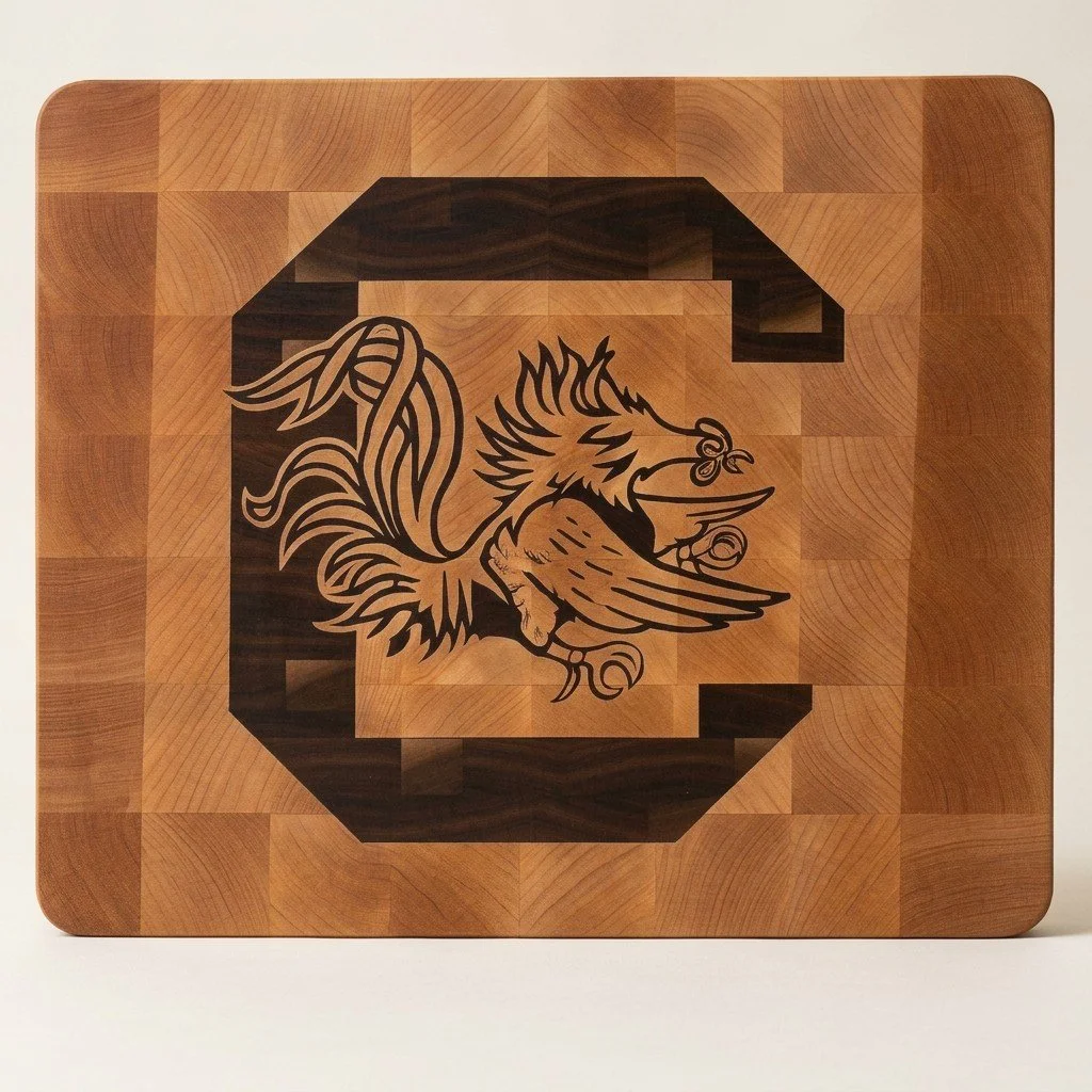 End-grain cutting board with an inlaid University of South Carolina Gamecocks logo by Saluda Dog Woodworks