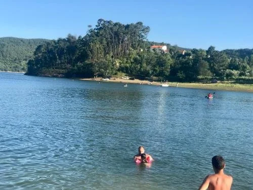 Bathing lake and river beach in the village