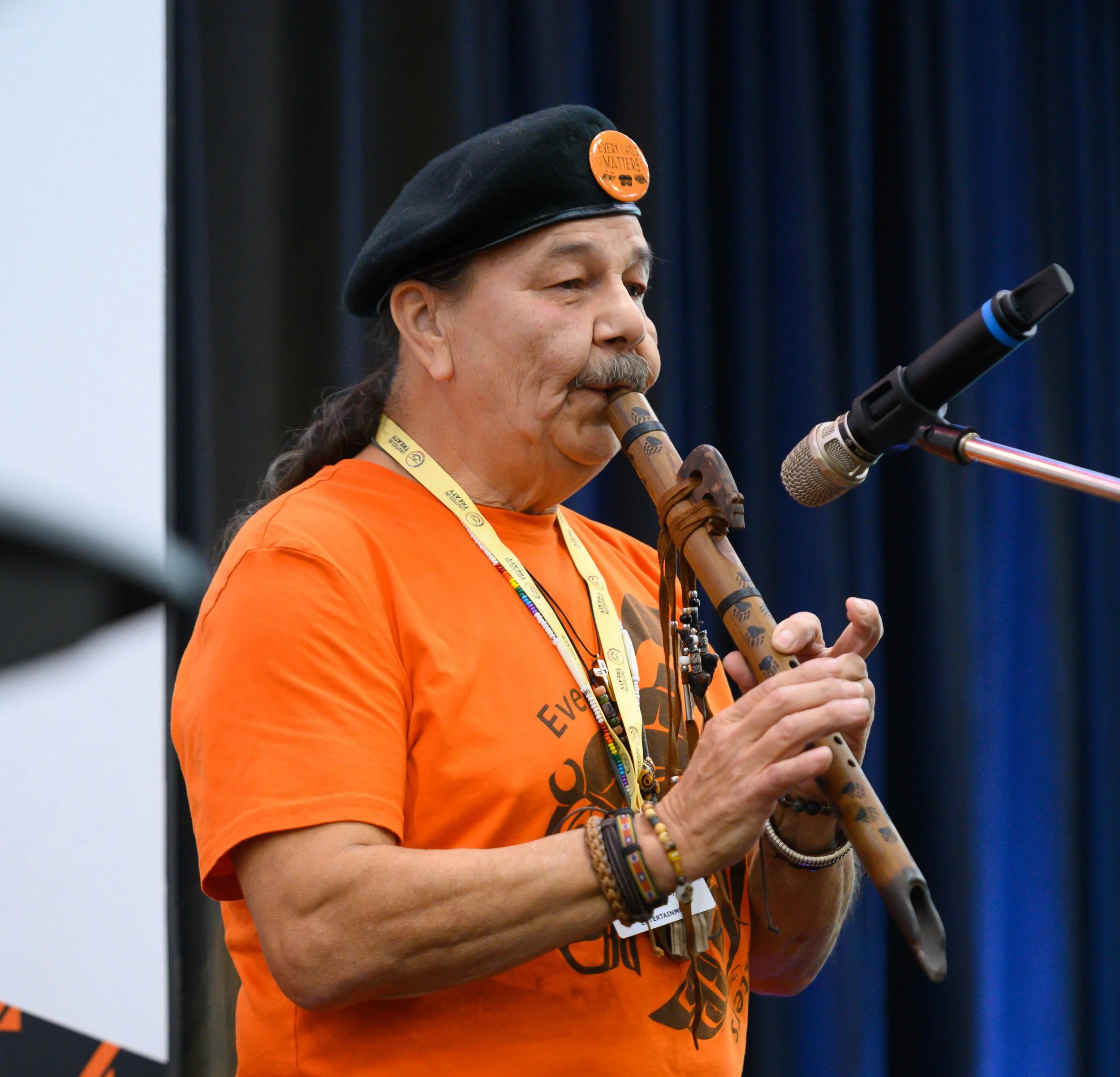 Elderly man playing the flute