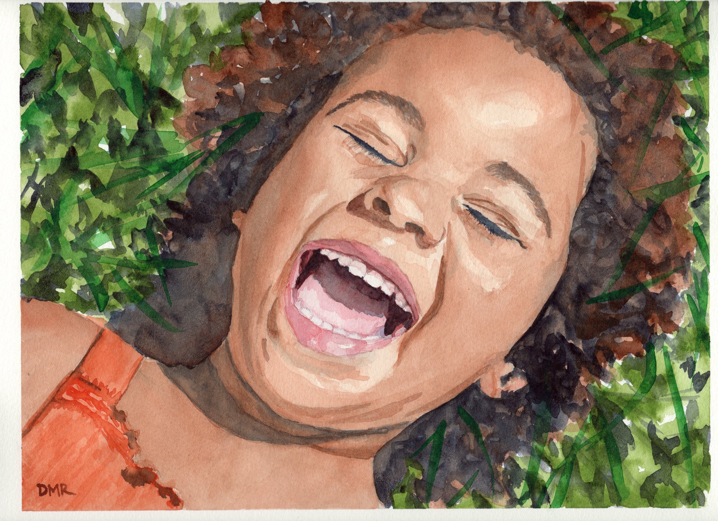 Girl laughing in grass.jpg