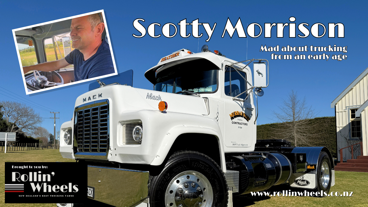 Vintage white Mack truck with black accents parked outdoors against a clear blue sky with a leafless tree and buildings in the background, featuring an inset photo of the owner driving a truck. The text says Scottie Morrison. A Rollin Wheels logo is