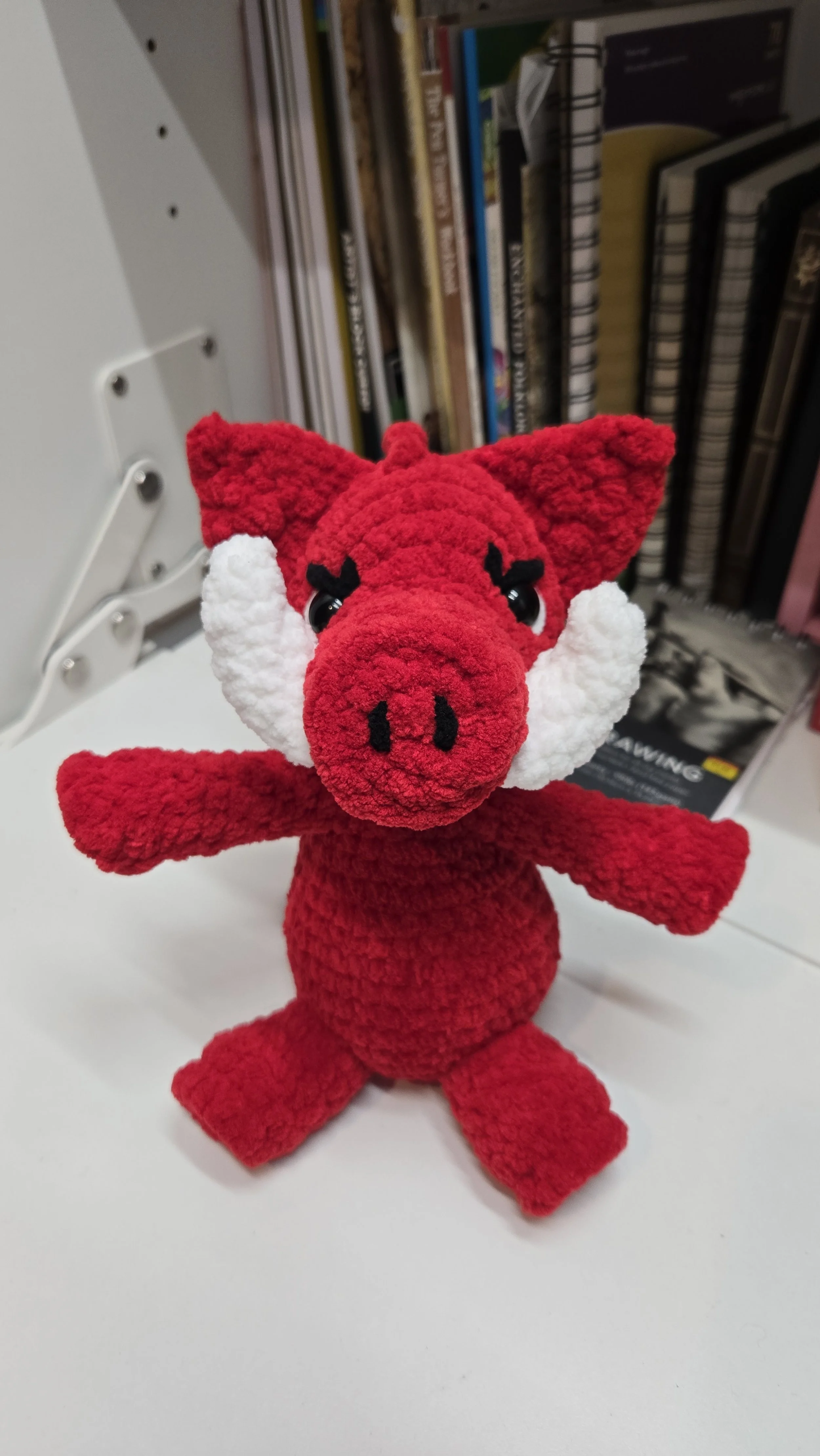Modified pig crochet pattern by Crochet Grove to create a Razorback for an Arkansas fan.