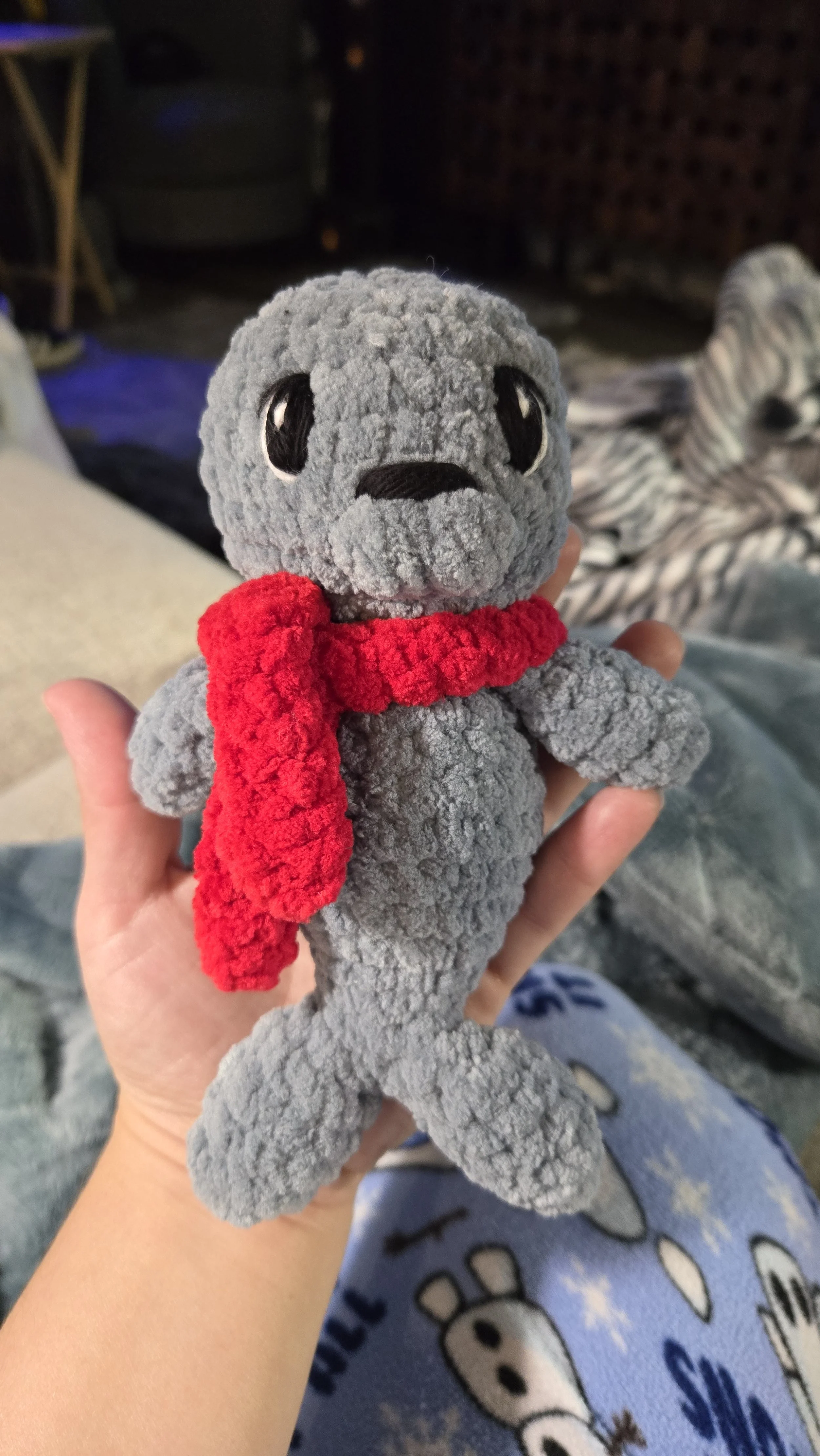Seal crochet pattern by Madeline Mae Co, modified with embroidered eyes to make it baby safe for a new mom.