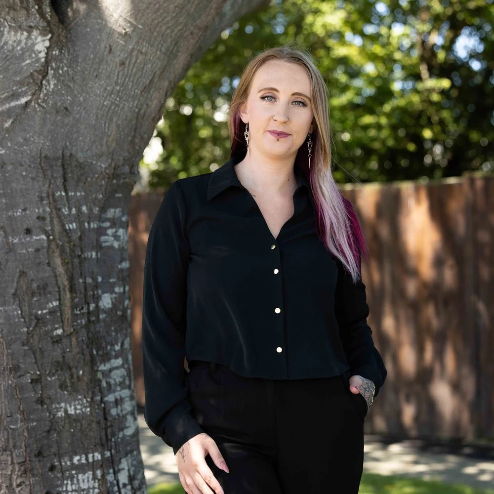 krystal leaning on tree smiling