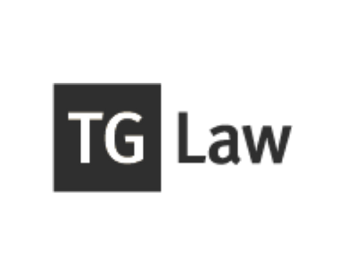 TG Law logo with black text and a gray background behind the letters 'TG'.