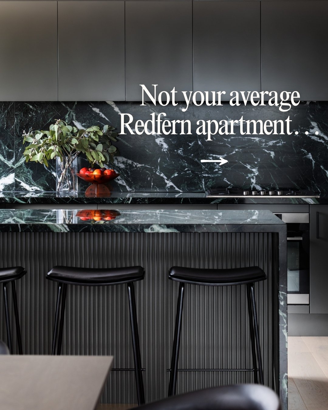 Sitting high above Redfern with incredible city views, this three-bed apartment has been completely stripped back and reimagined by @michaelallsoppdesign. Soft curves, layered timbers, beautifully detailed marble and custom joinery everywhere you loo