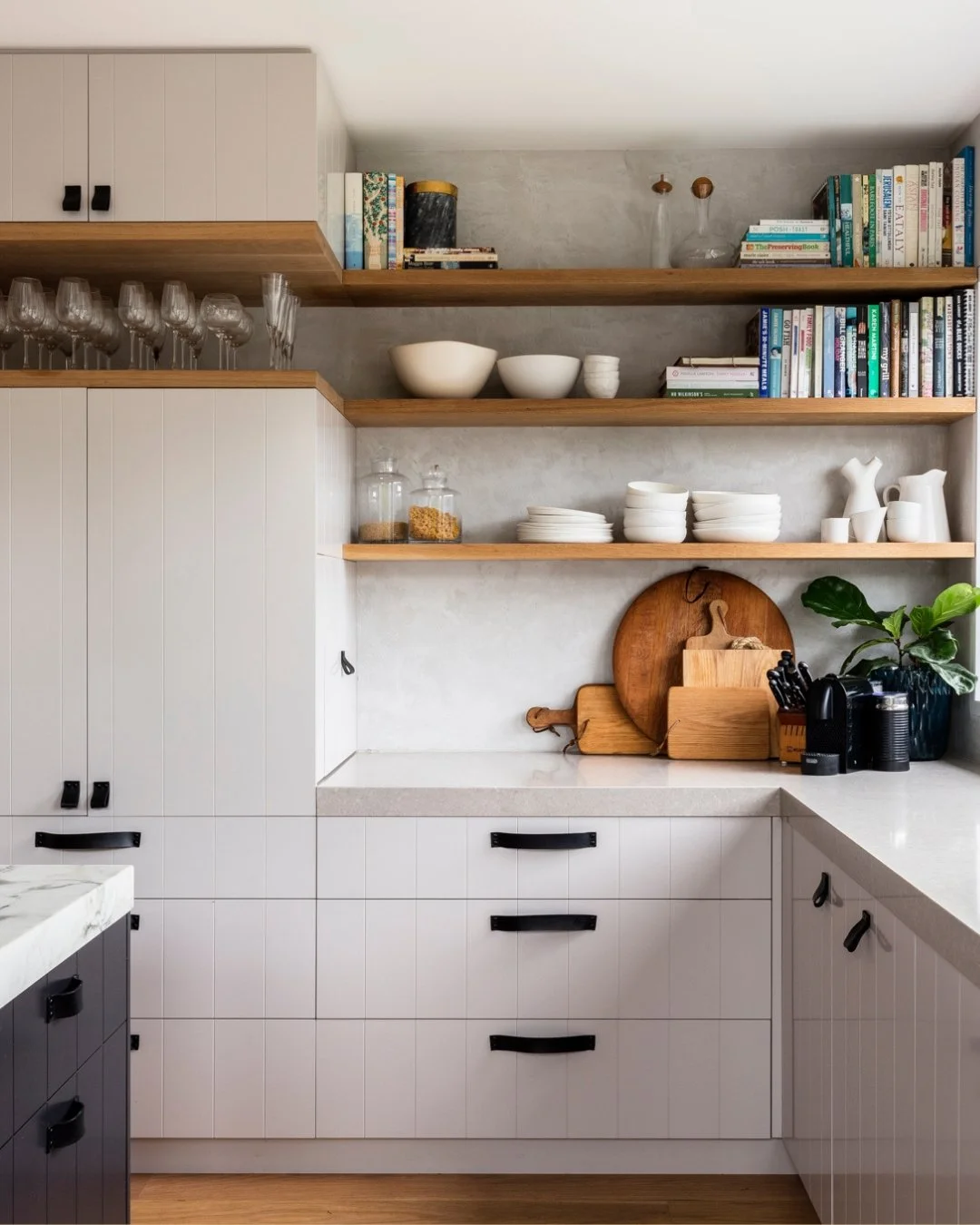 Designer kitchen with integrated appliances, concealed storage and stone island for kitchen renovation inspiration. This kitchen is available to download and have the professional plans to use in your home renovation